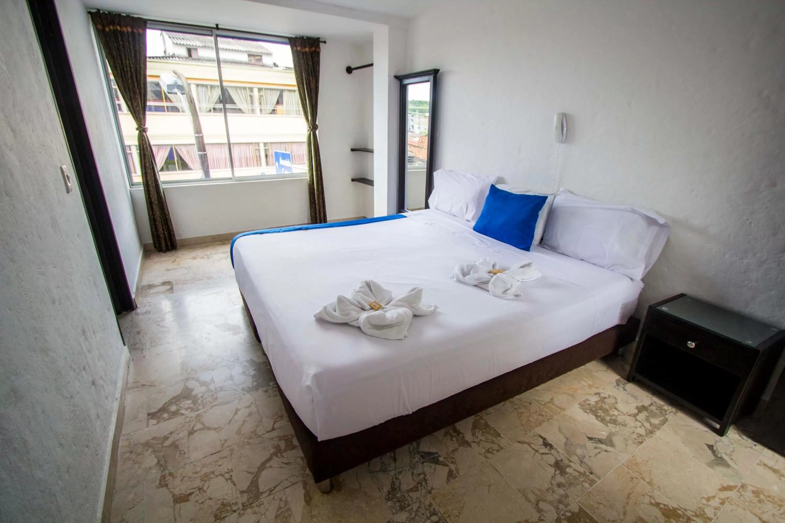 Bed in Blue Star Hotel