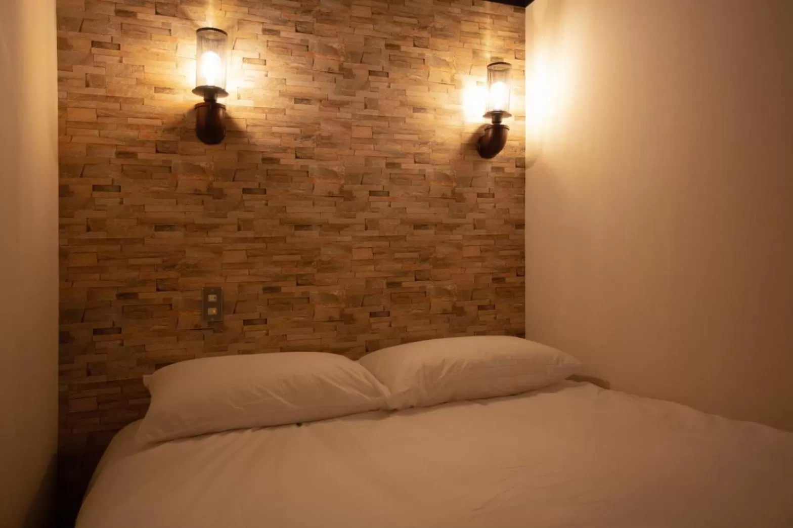 Bed in The Rooms Inn