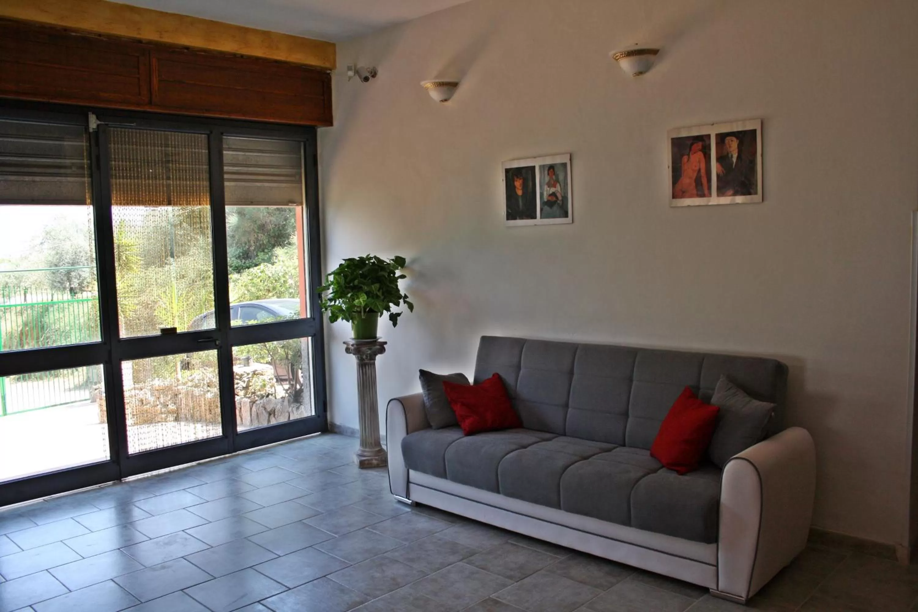 Communal lounge/ TV room in B&B Borgo Pileri