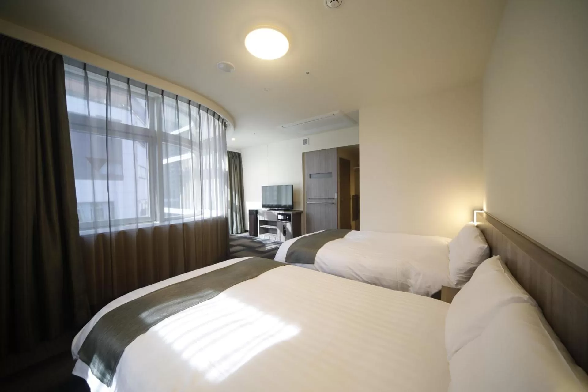 Bed in Dormy Inn Korakuen