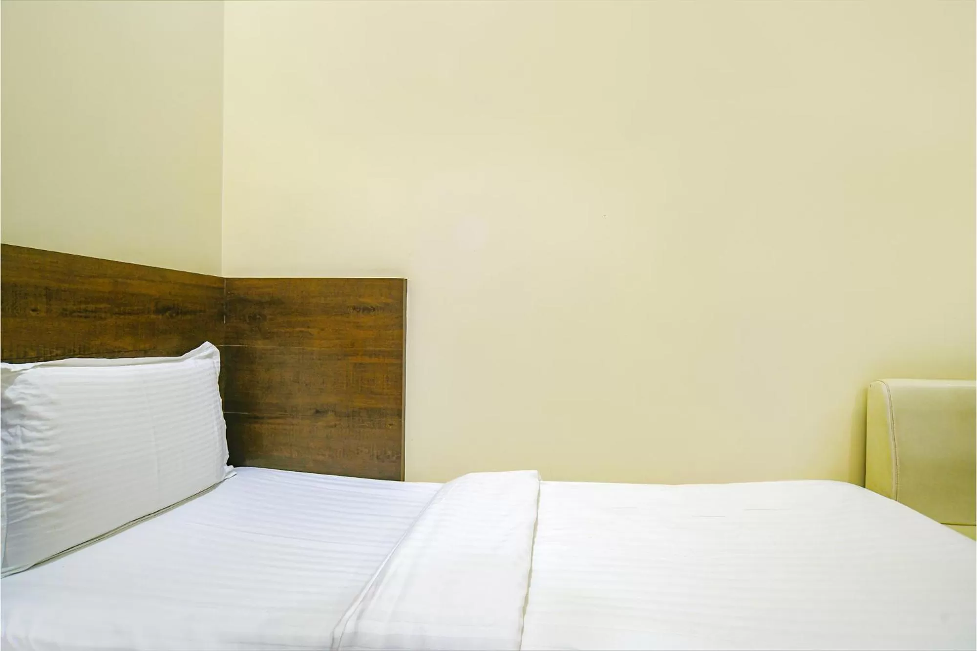 Bed in FabHotel Satyug Jaisinghpura