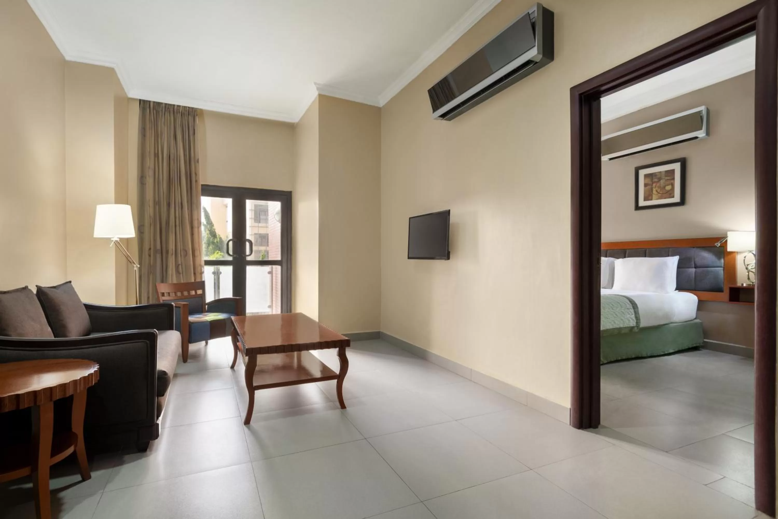 Living room, Bed in Hawthorn Suites by Wyndham Abuja