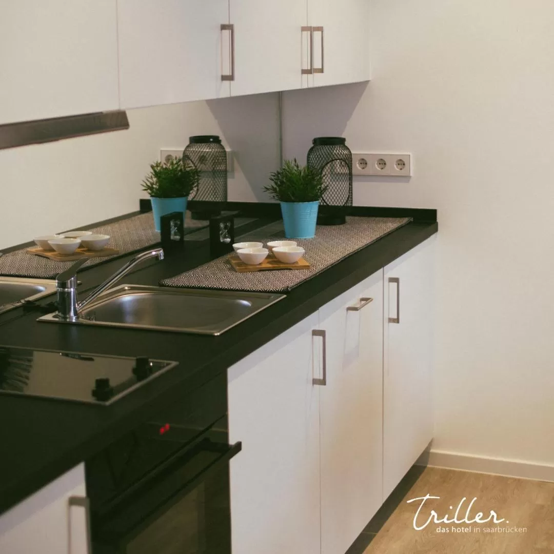 Kitchen or kitchenette in Hotel Am Triller - Hotel & Serviced Apartments