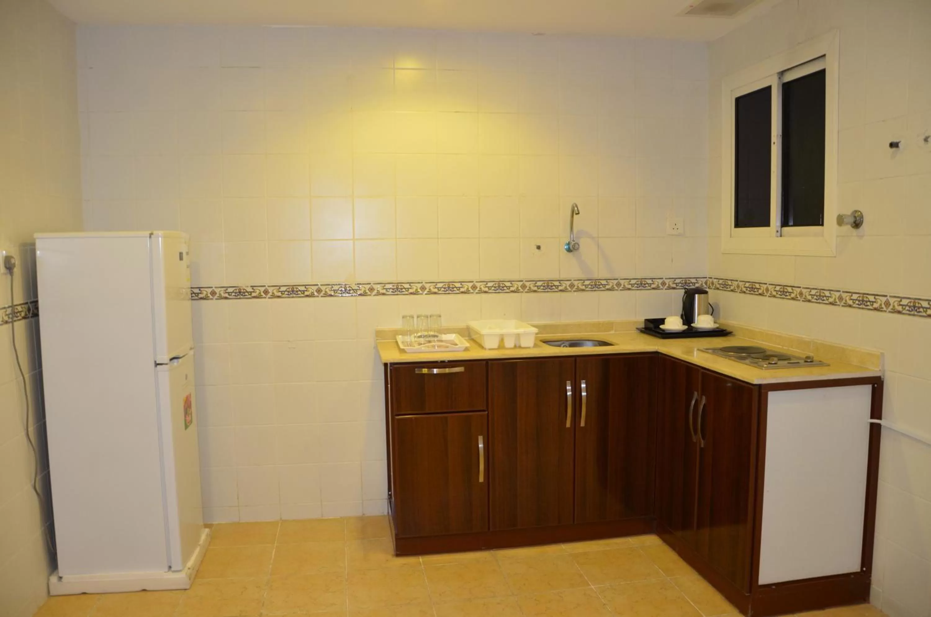Kitchen/Kitchenette in Jazan Heart Hotel