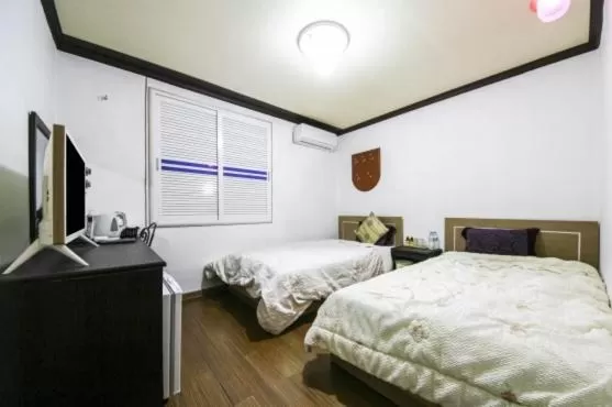 Bed in Saipan Motel with Sea View