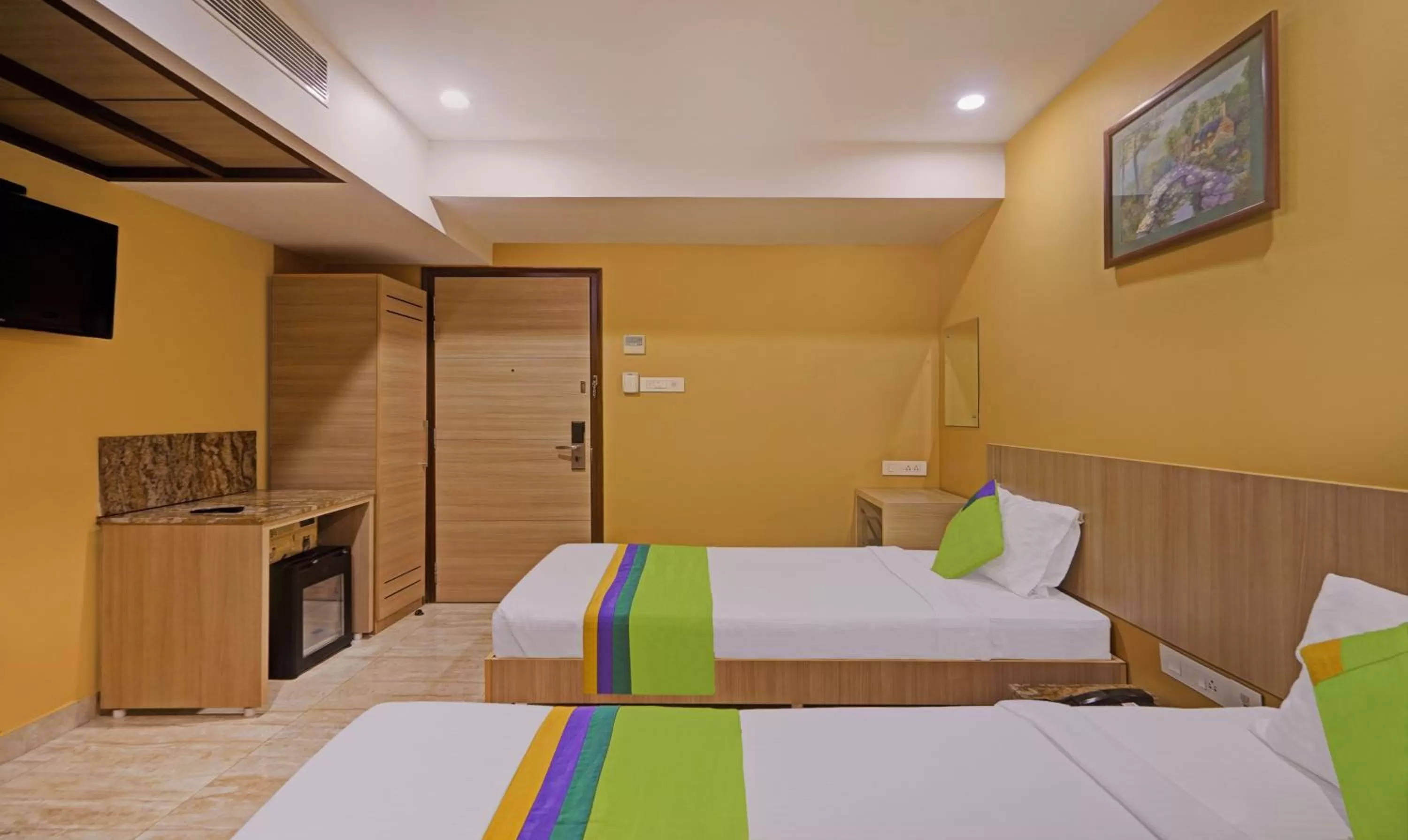 Bedroom, Bed in Treebo Fourth Avenue