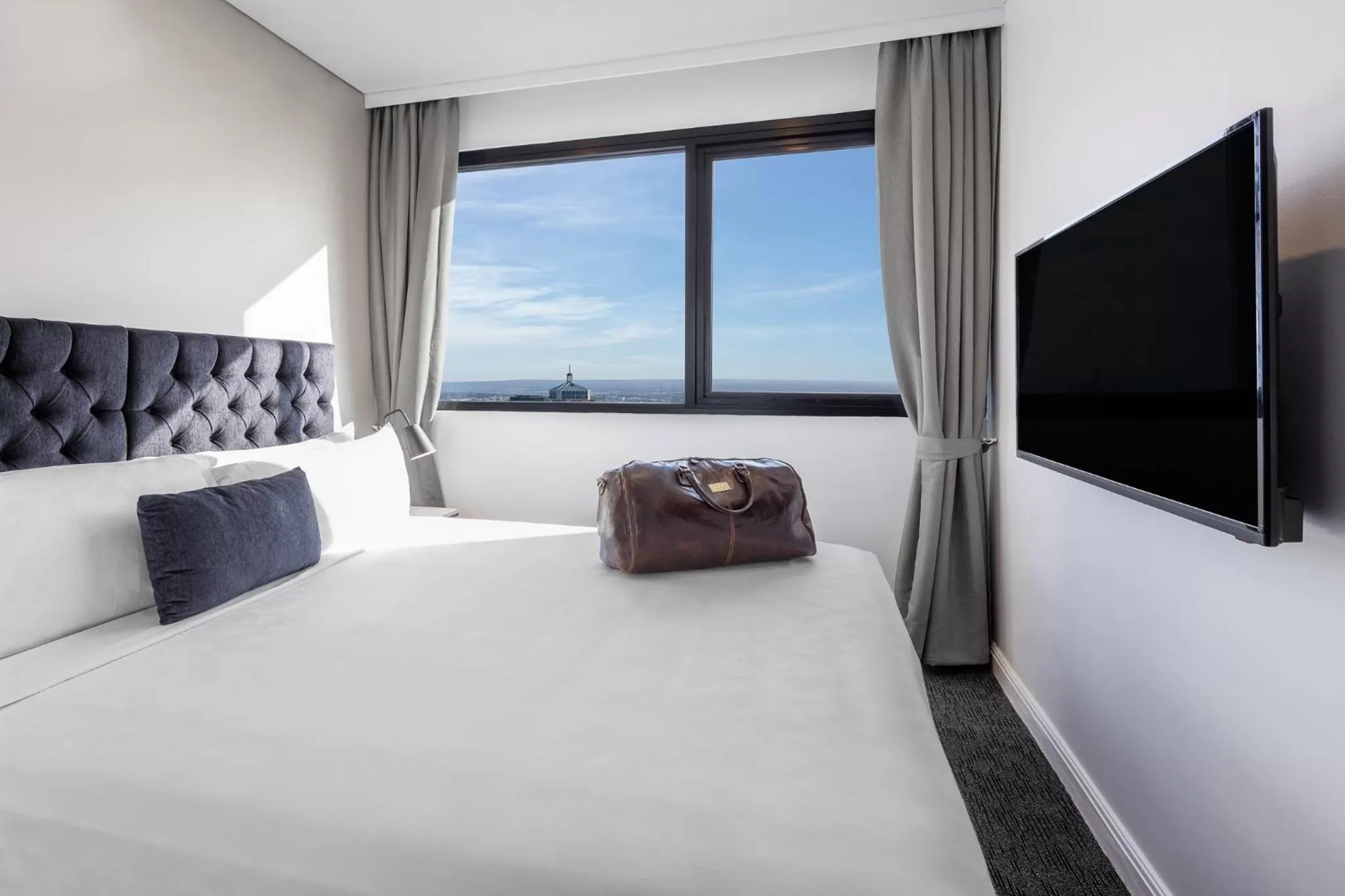 Bed in Meriton Suites Kent Street, Sydney