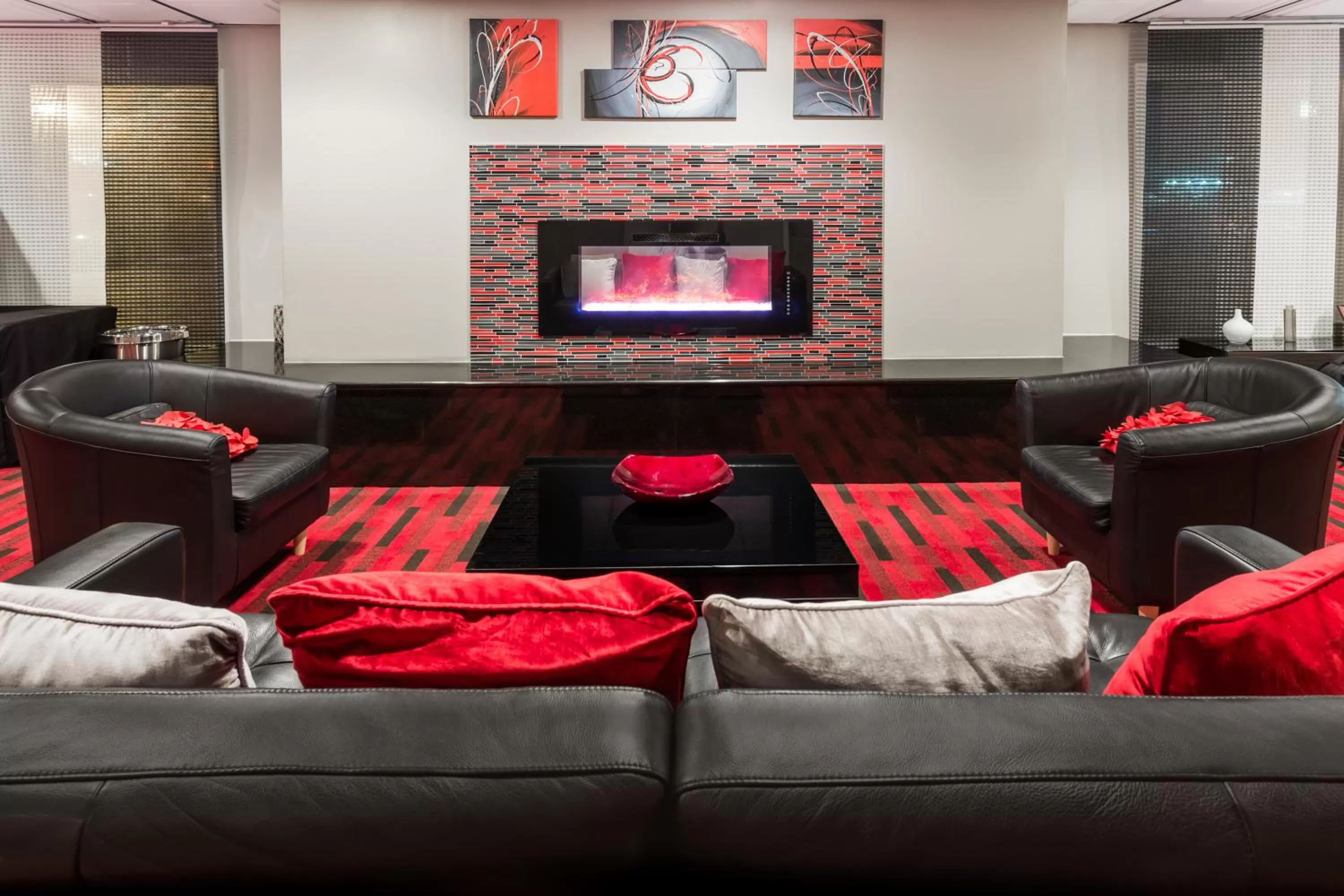 Communal lounge/ TV room in AmericInn by Wyndham Janesville