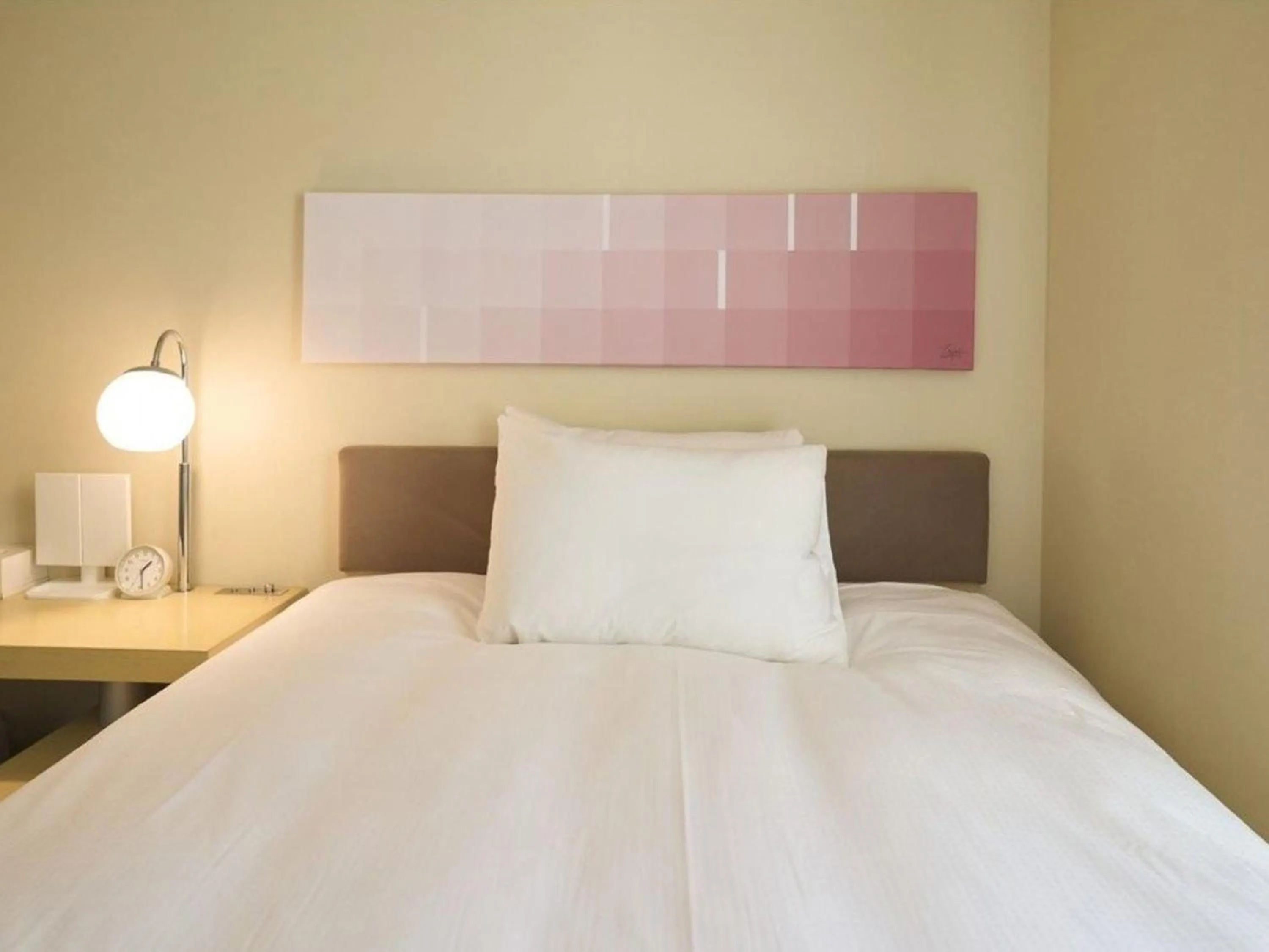 Bed in Hotel Resol Ikebukuro