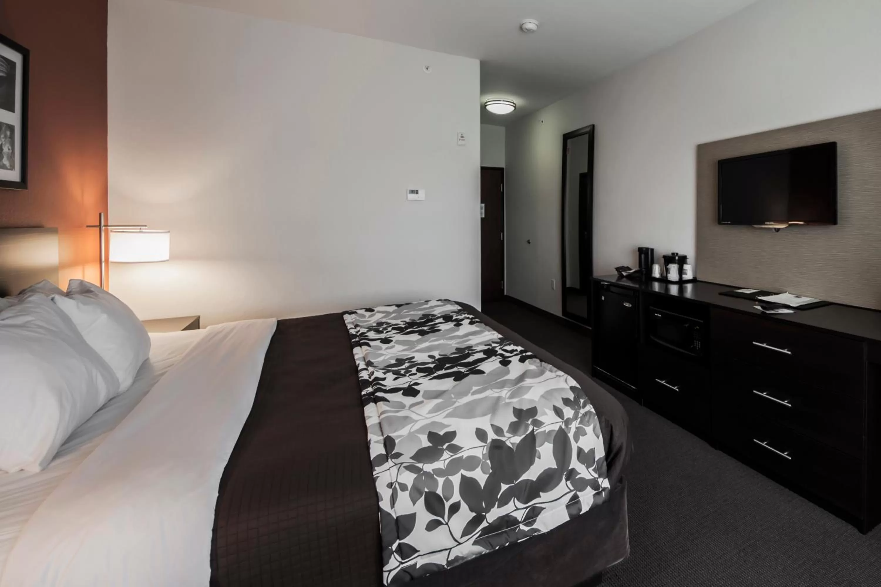 Bed in Sleep Inn & Suites Hennessey