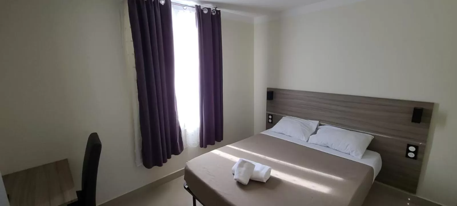 Bed in ESPERANCE HOTEL