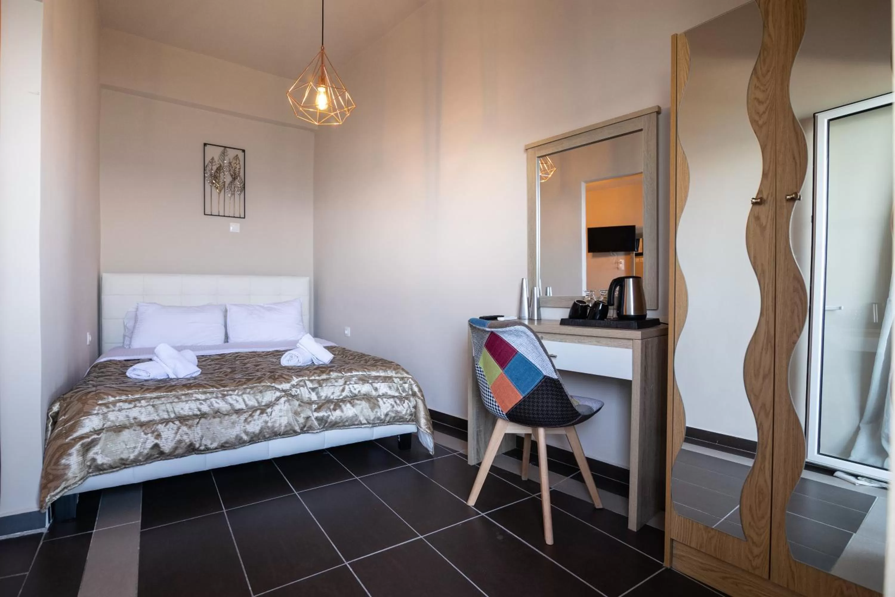 Bed in Votsalakia Hotel & Luxury Apartments