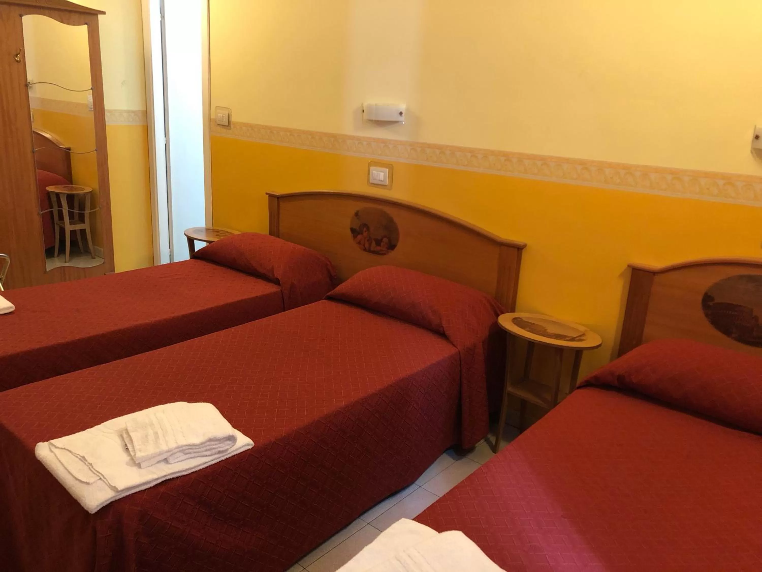 Bed in Hotel Cherubini