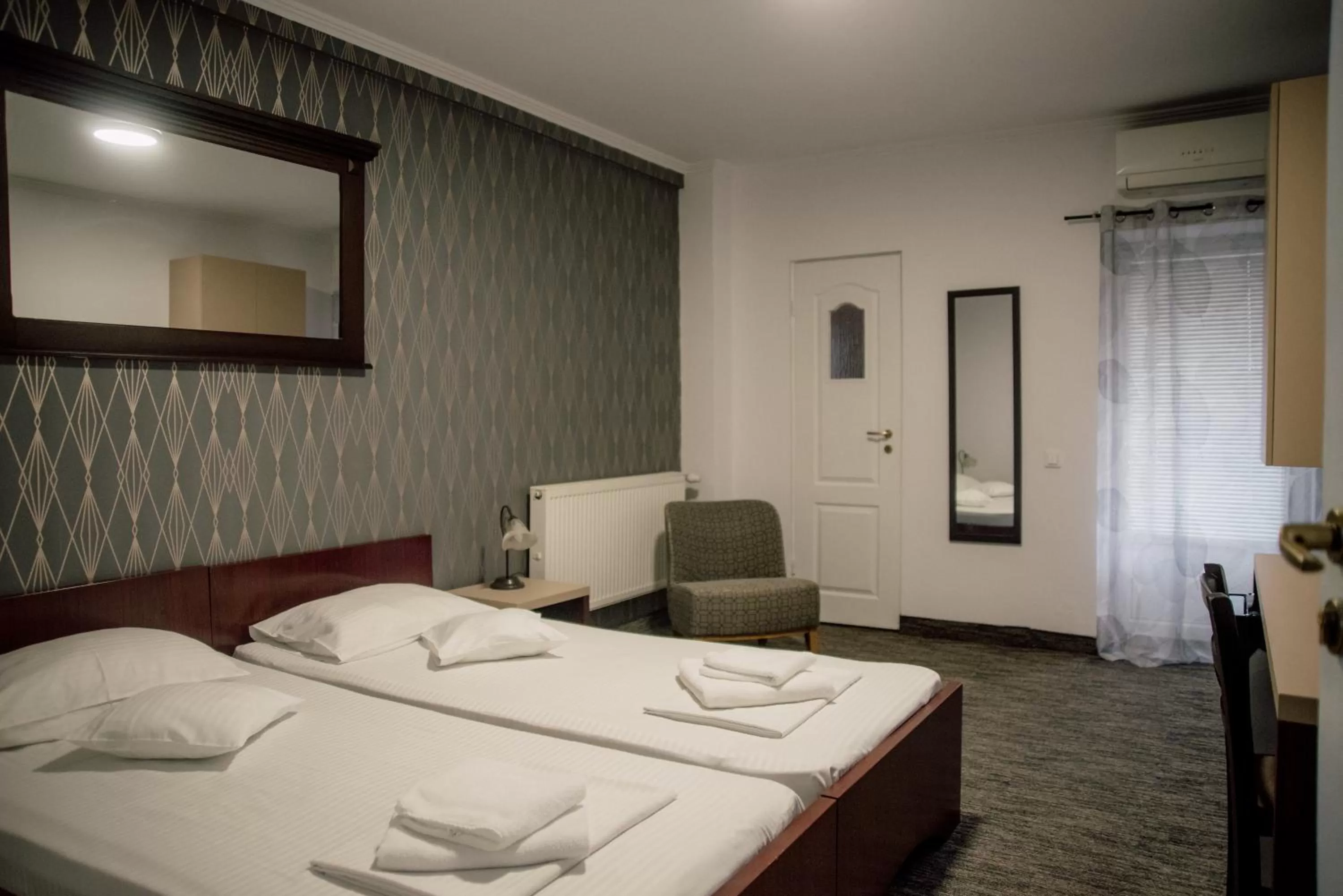 Bed in Carnival City Hotel Oradea