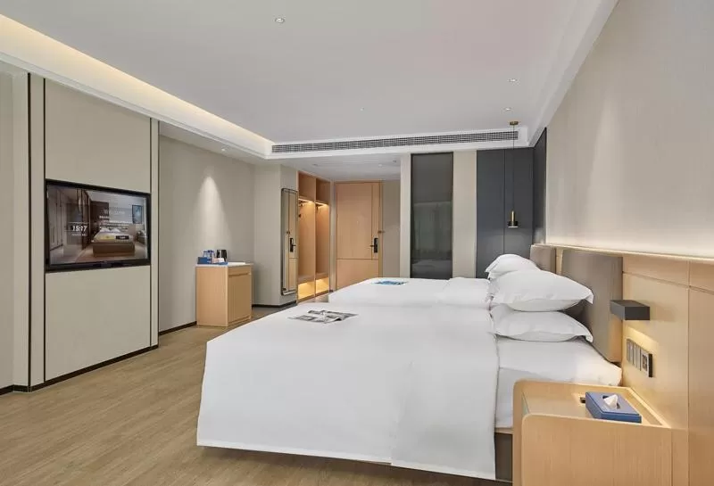 Photo of the whole room, Bed in Fengyue Light Shang Hotel Guangzhou Baiyun Airport Store
