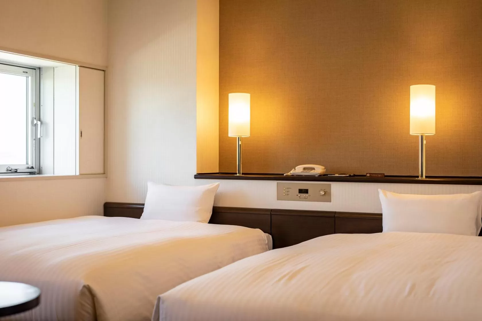 Bed in Nishitetsu Inn Kurosaki