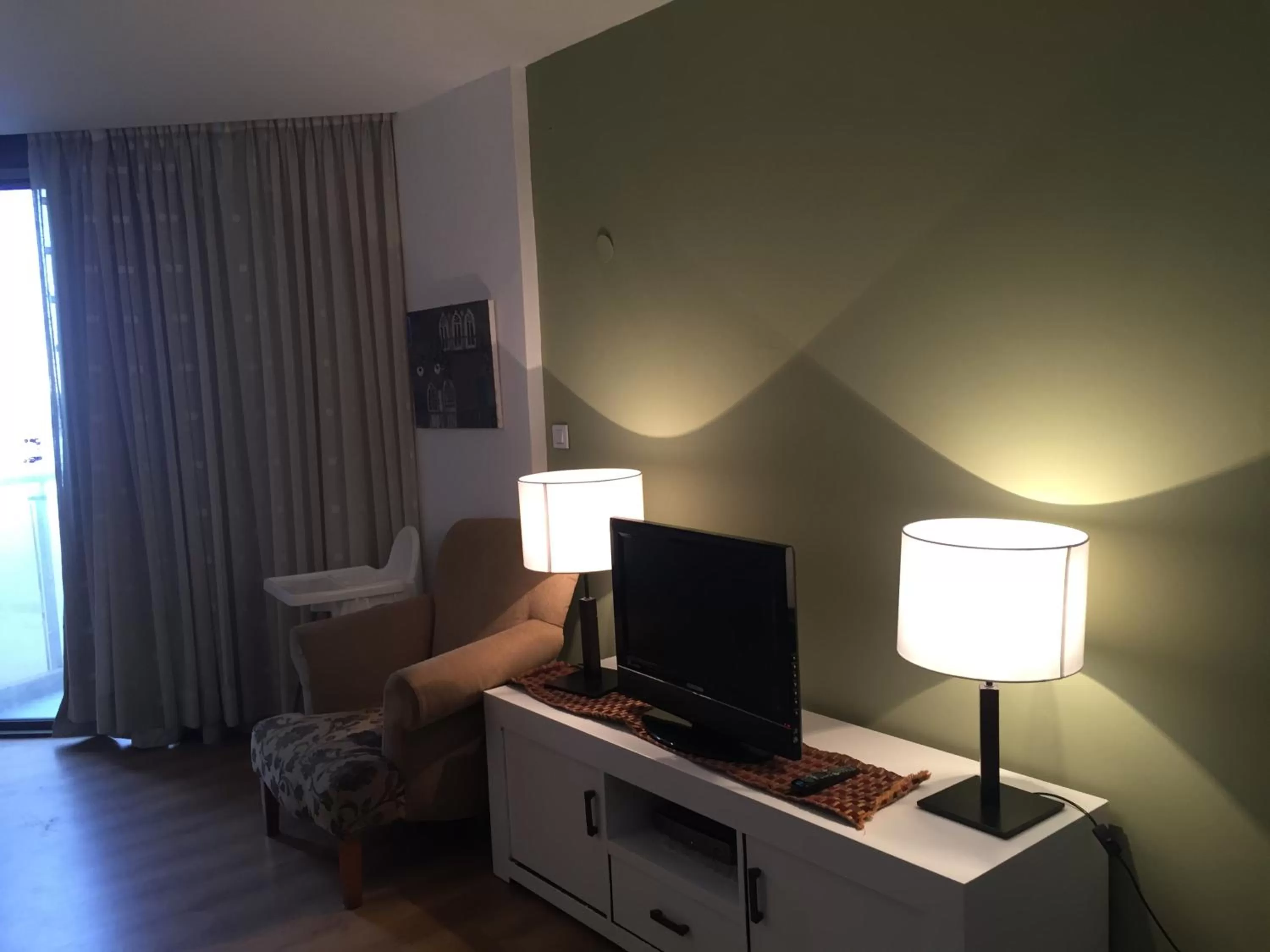 Living room, TV/Entertainment Center in Raphael Apartments