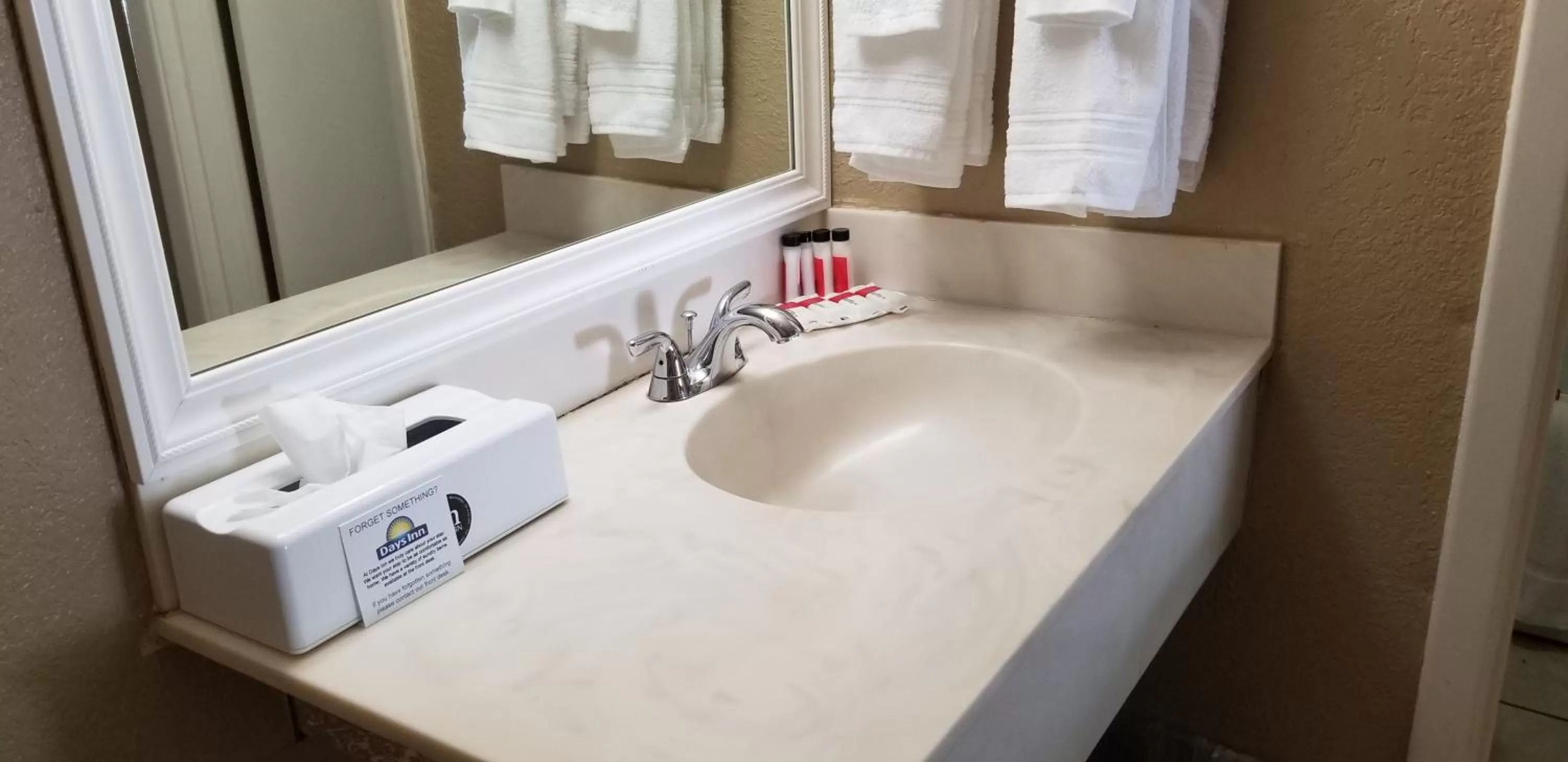 Bathroom in Days Inn by Wyndham Cocoa Cruiseport West At I-95/524