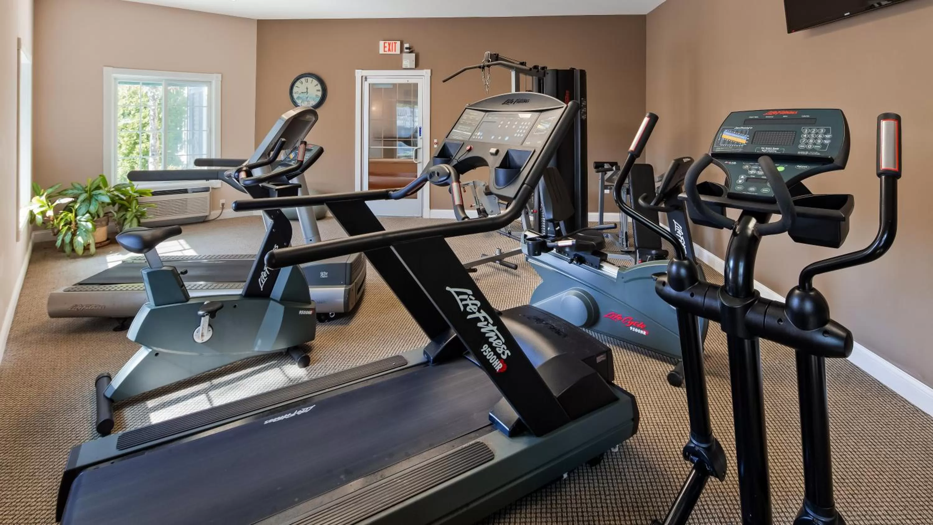 Fitness centre/facilities in Apple Tree Inn; SureStay Collection by Best Western