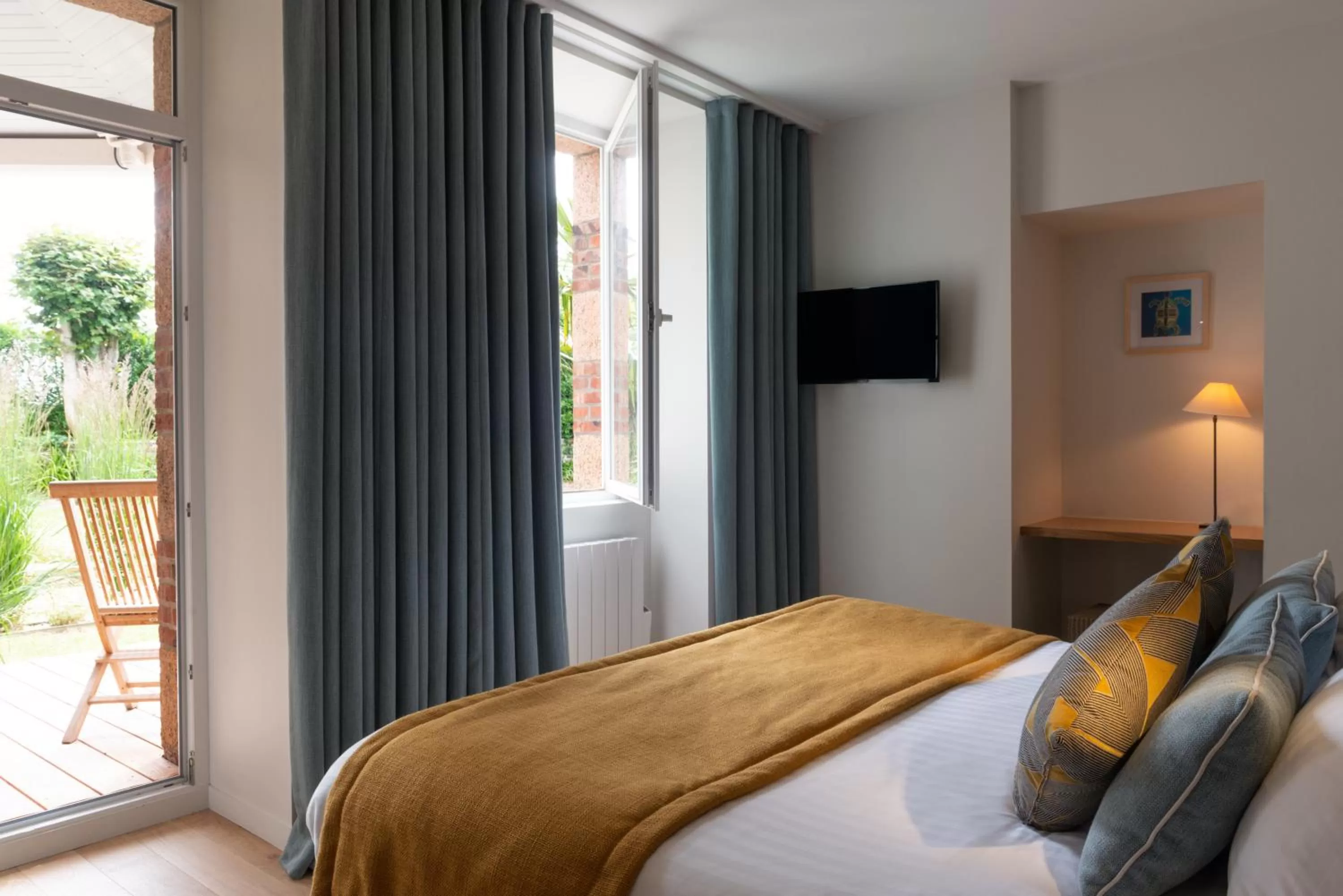 Patio, Bed in Hôtel Les Costans, The Originals Relais