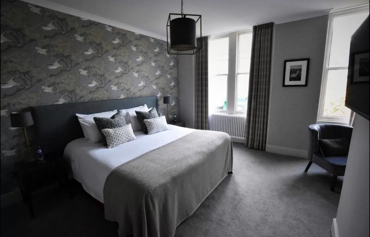 Bed in Rooms at the Saint