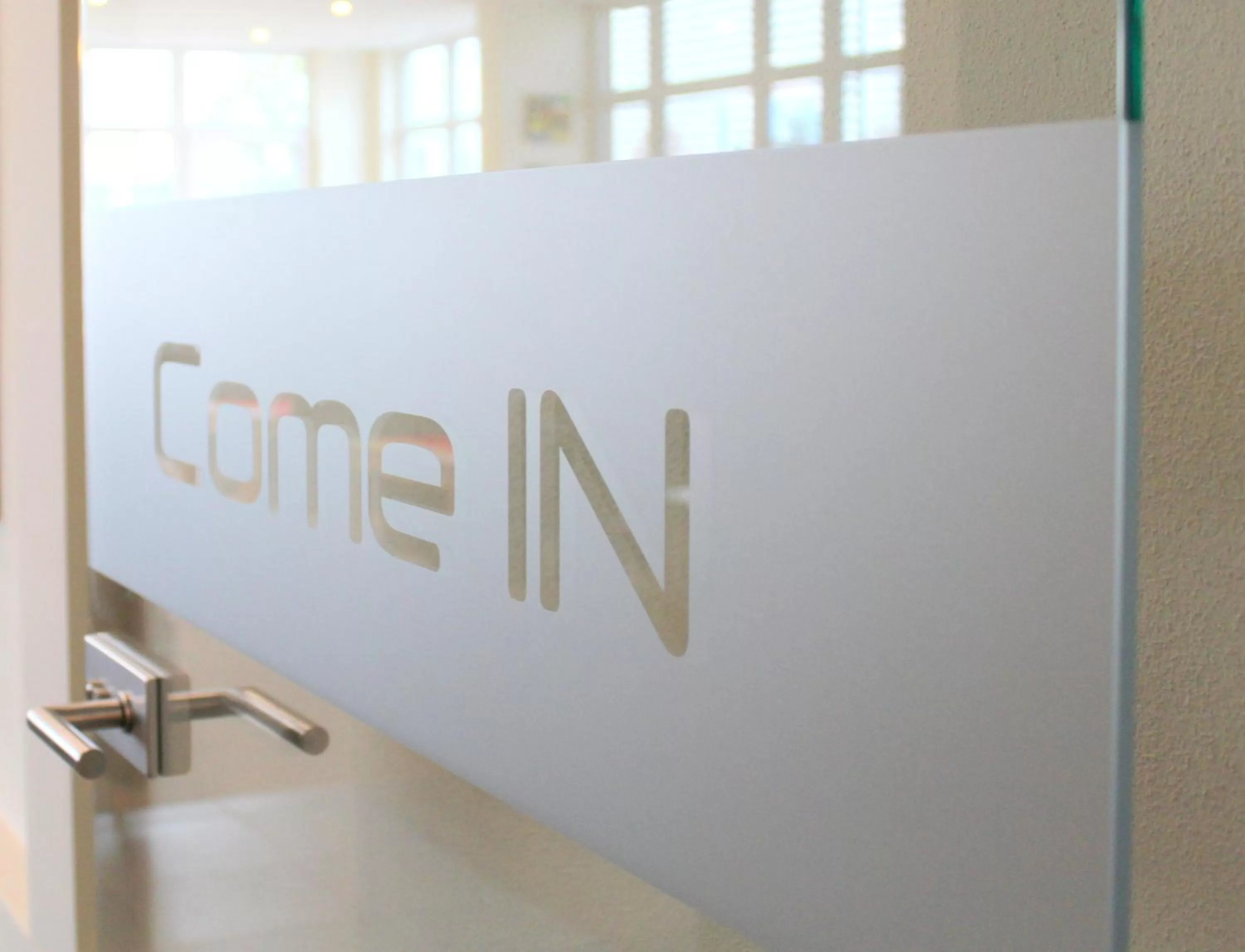 Property logo or sign in Come IN Hotel