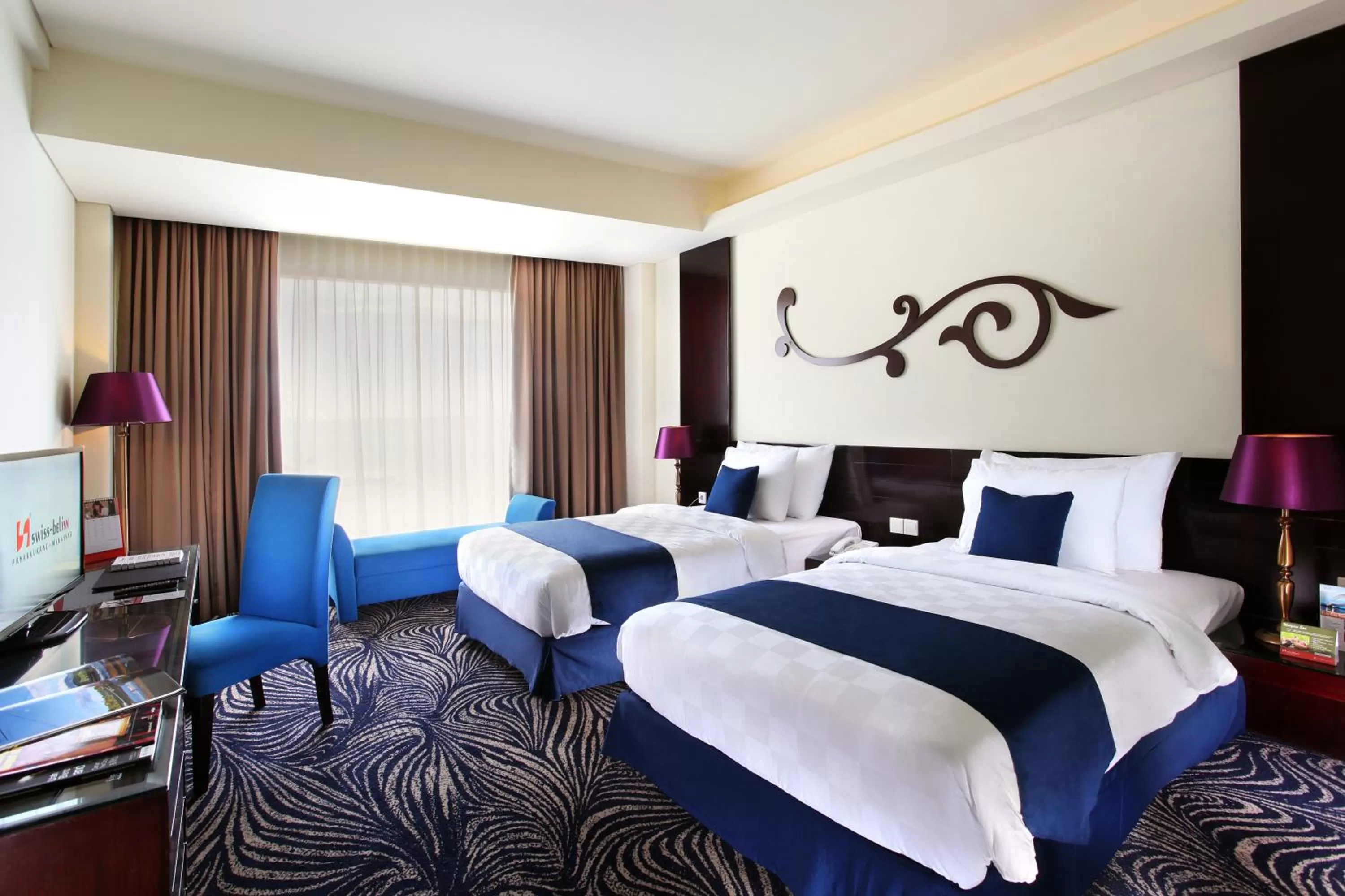 Bed in Swiss-Belhotel Silae Palu
