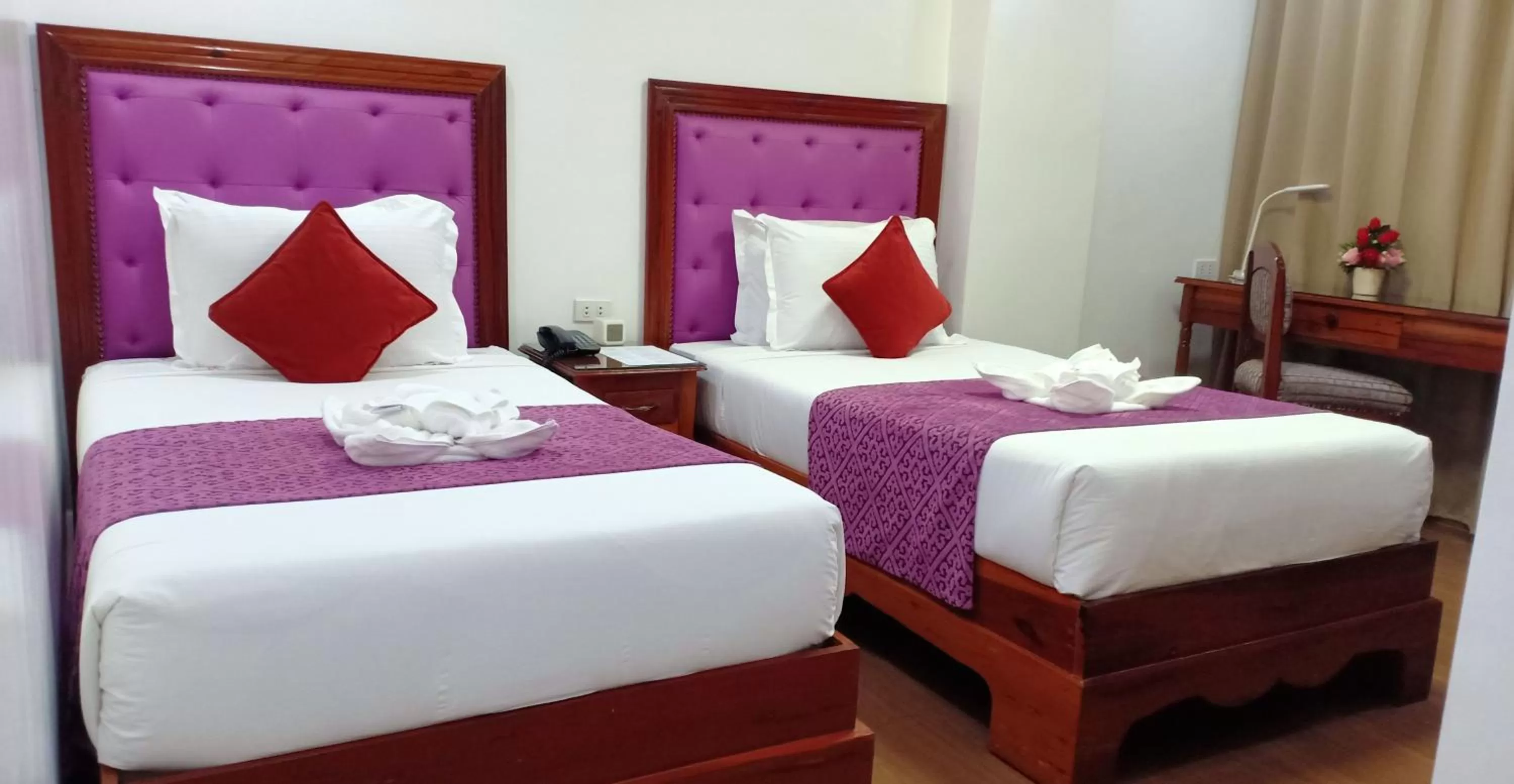 Bed in CLN Boutique Hotel