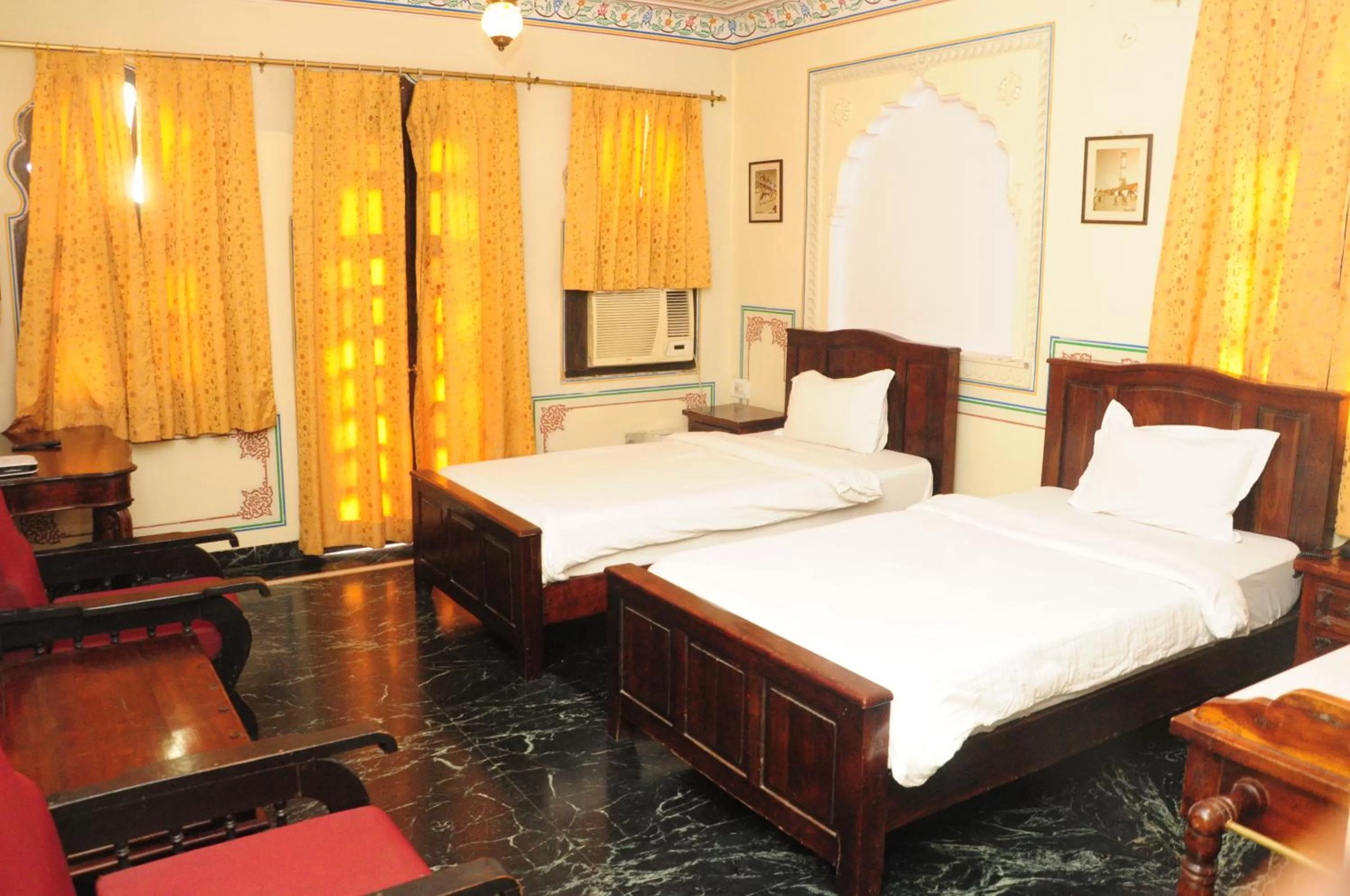 Photo of the whole room, Bed in Sajjan Niwas