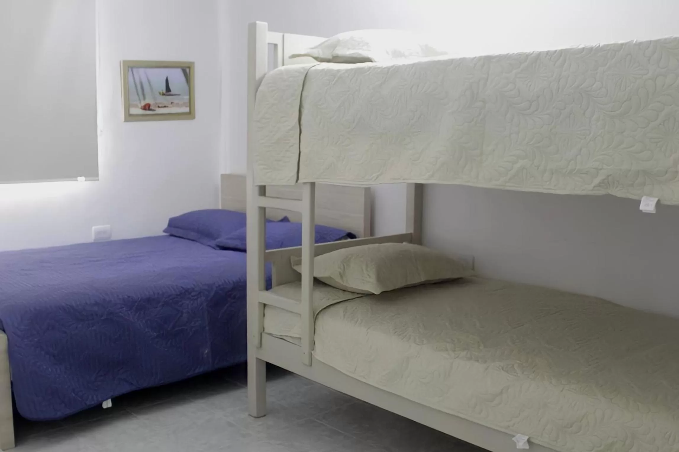 Bed in Hotel Iraka Zenu