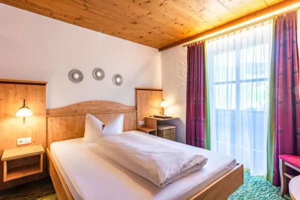 Bed in Das Maximilian - Feines Landhotel am Schliersee