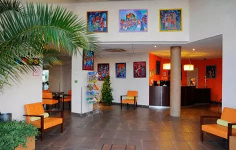 Lobby or reception in The Originals Boutique, Actuel Hôtel, Saint-Etienne Aéroport