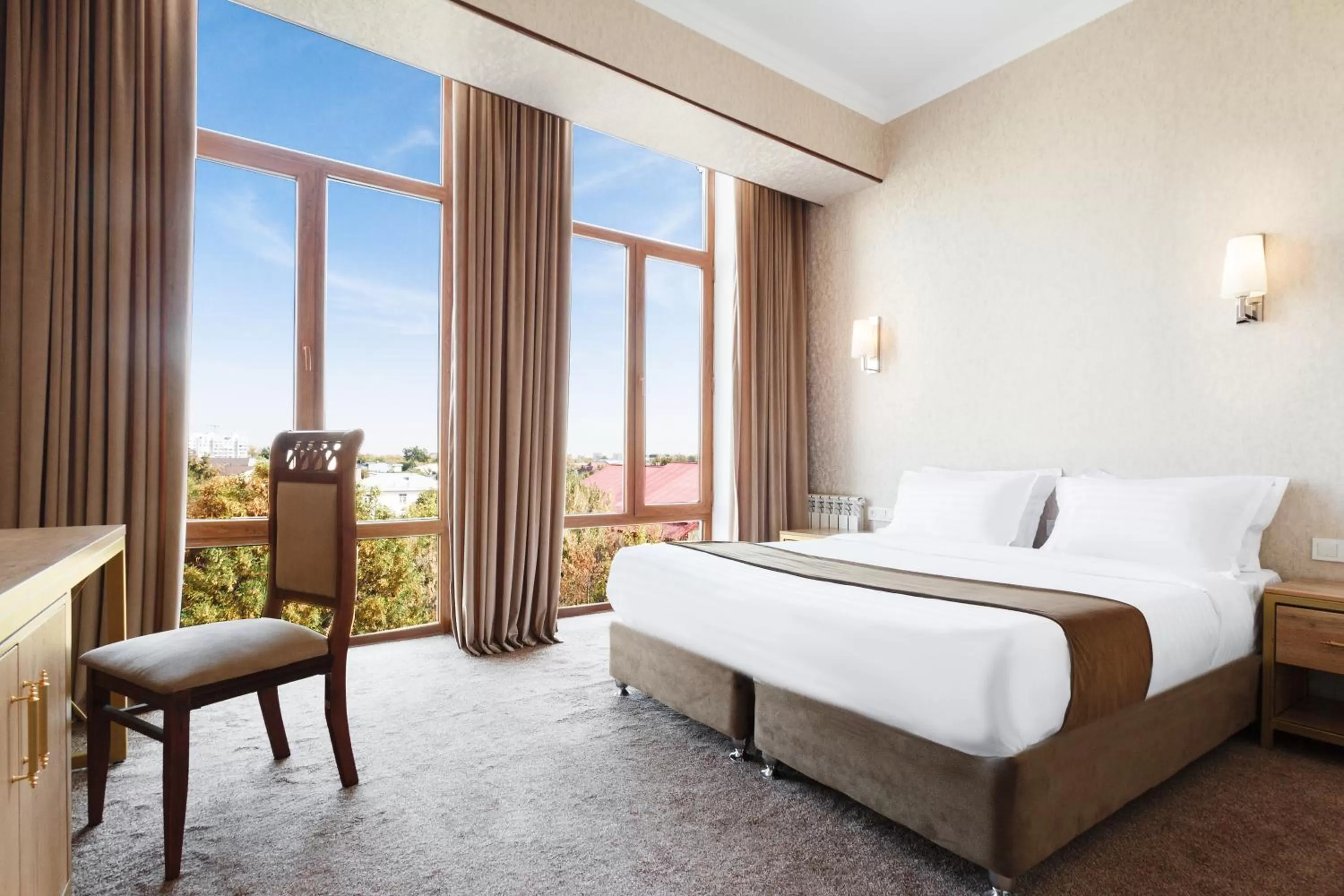 Bed in Western Suites Hotel