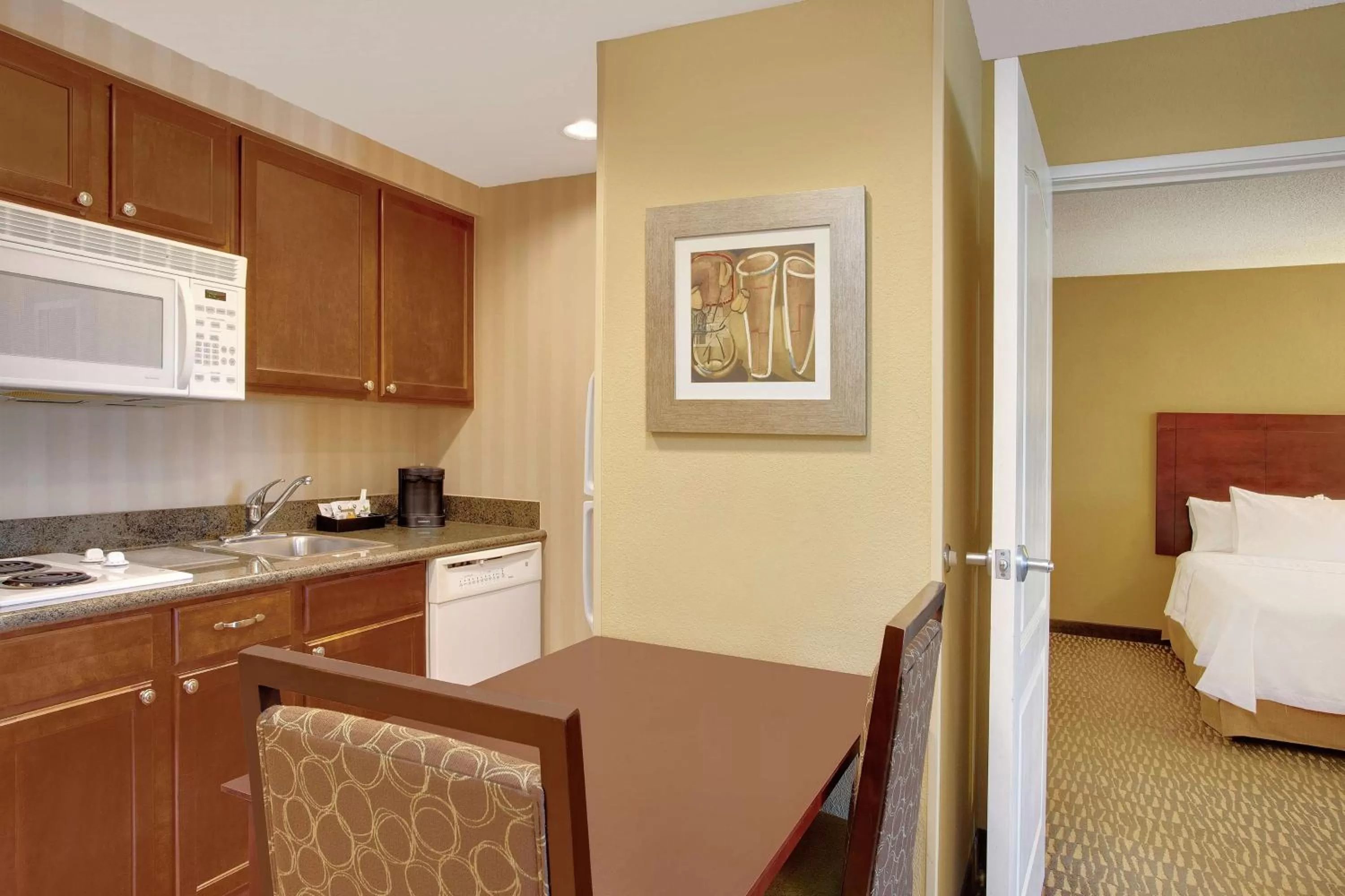 Kitchen or kitchenette, Bed in Homewood Suites by Hilton Tampa-Brandon