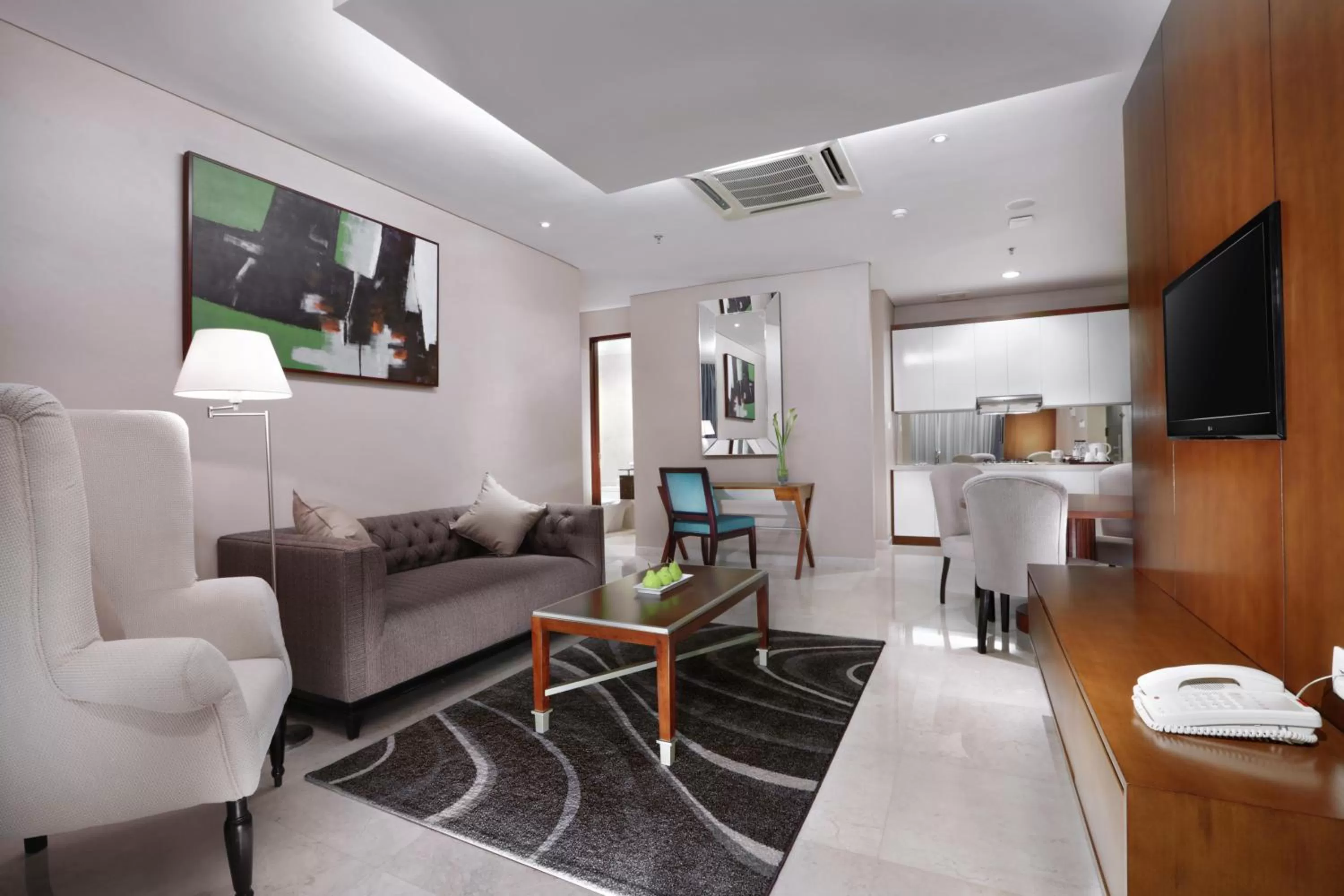 Living room in The Grove Suites by Grand Aston