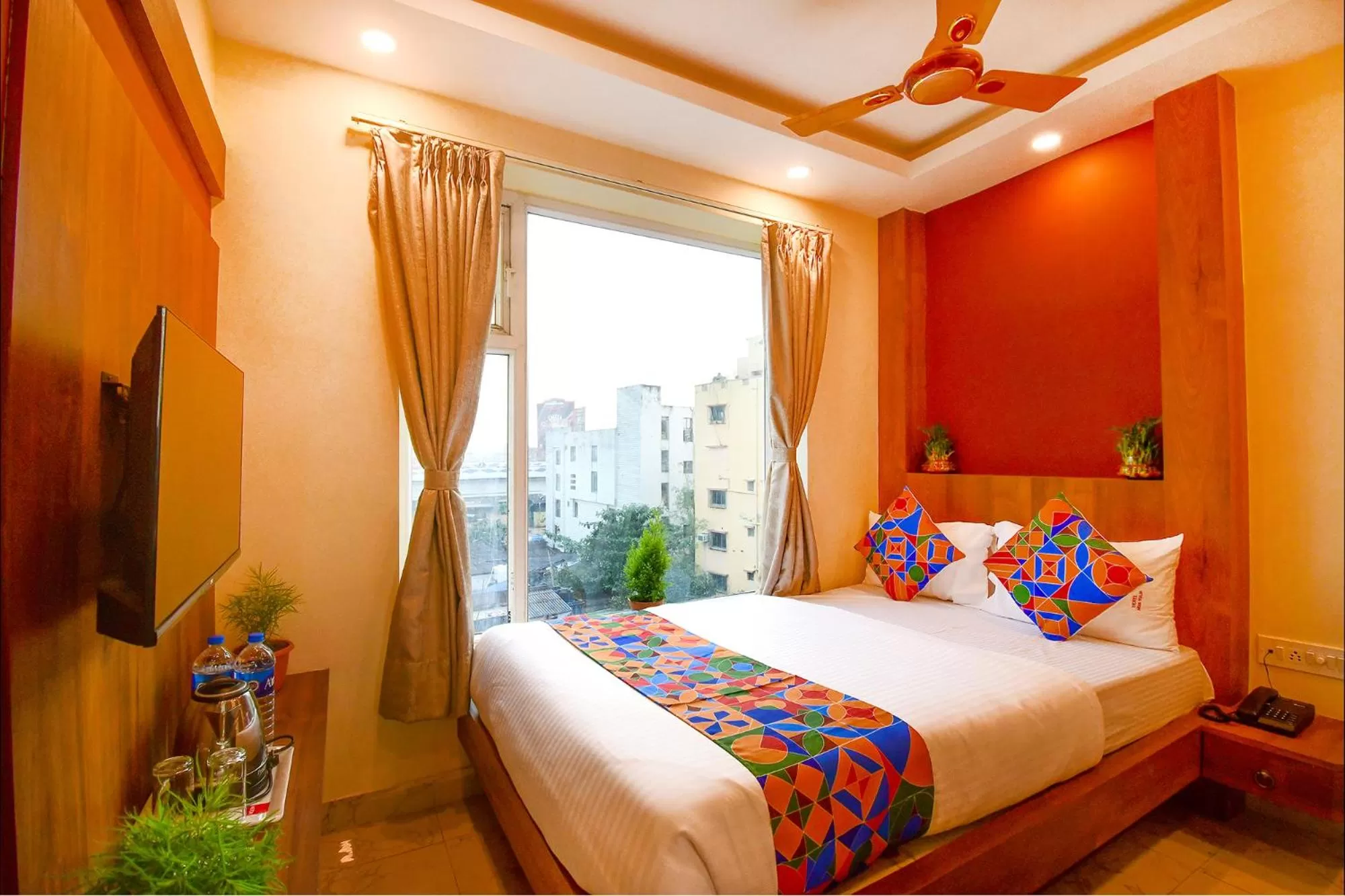 Communal lounge/ TV room, Bed in FabHotel Aqua Tulip - Nr Milan Mela