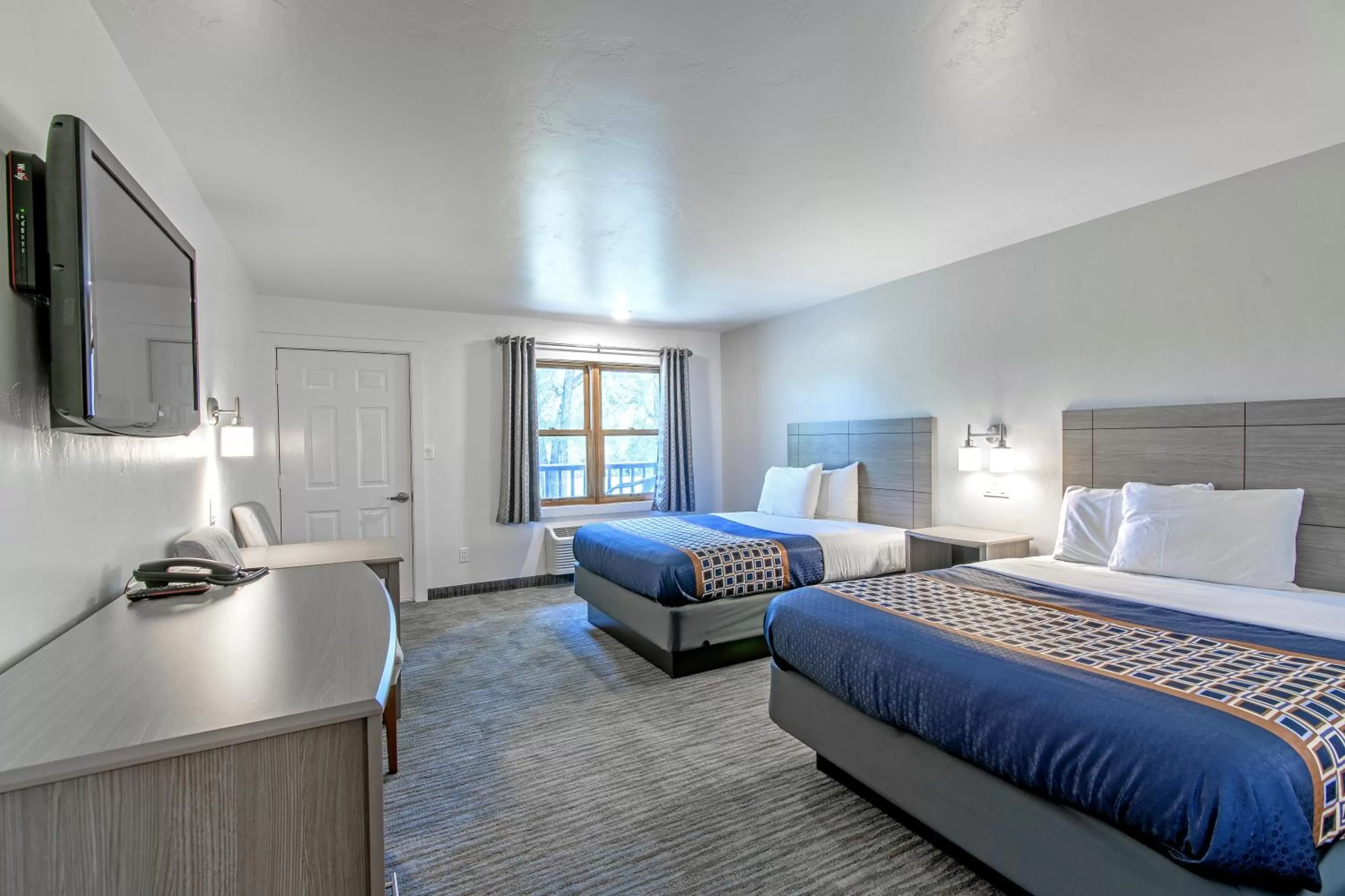 Bed in The Gunnison Inn at Dos Rios Golf Course