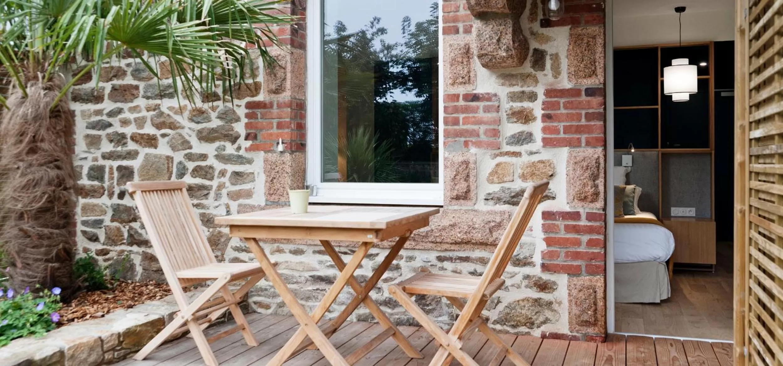 Patio in Hôtel Les Costans, The Originals Relais