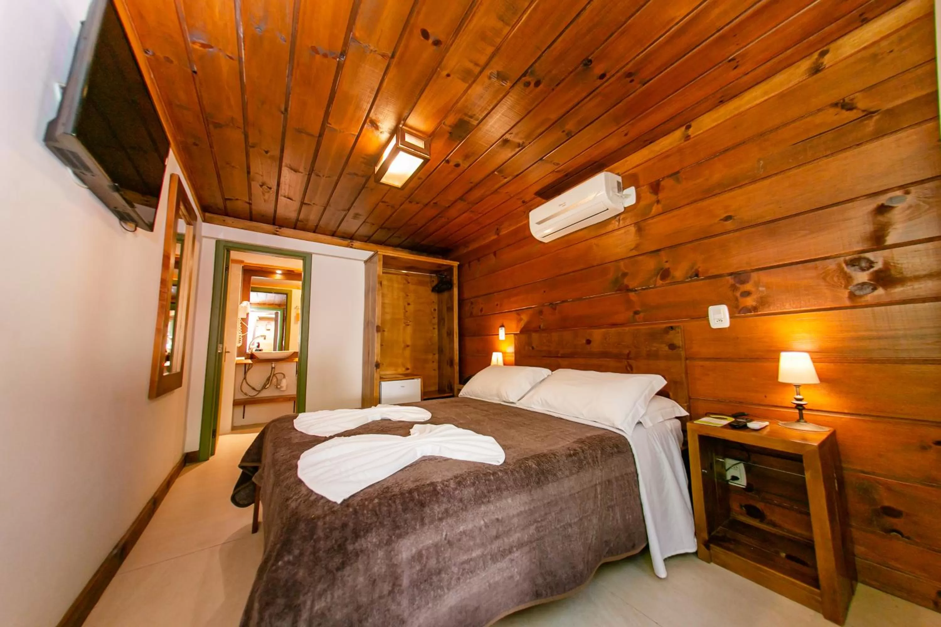 Bed in Pousada Charm Canela