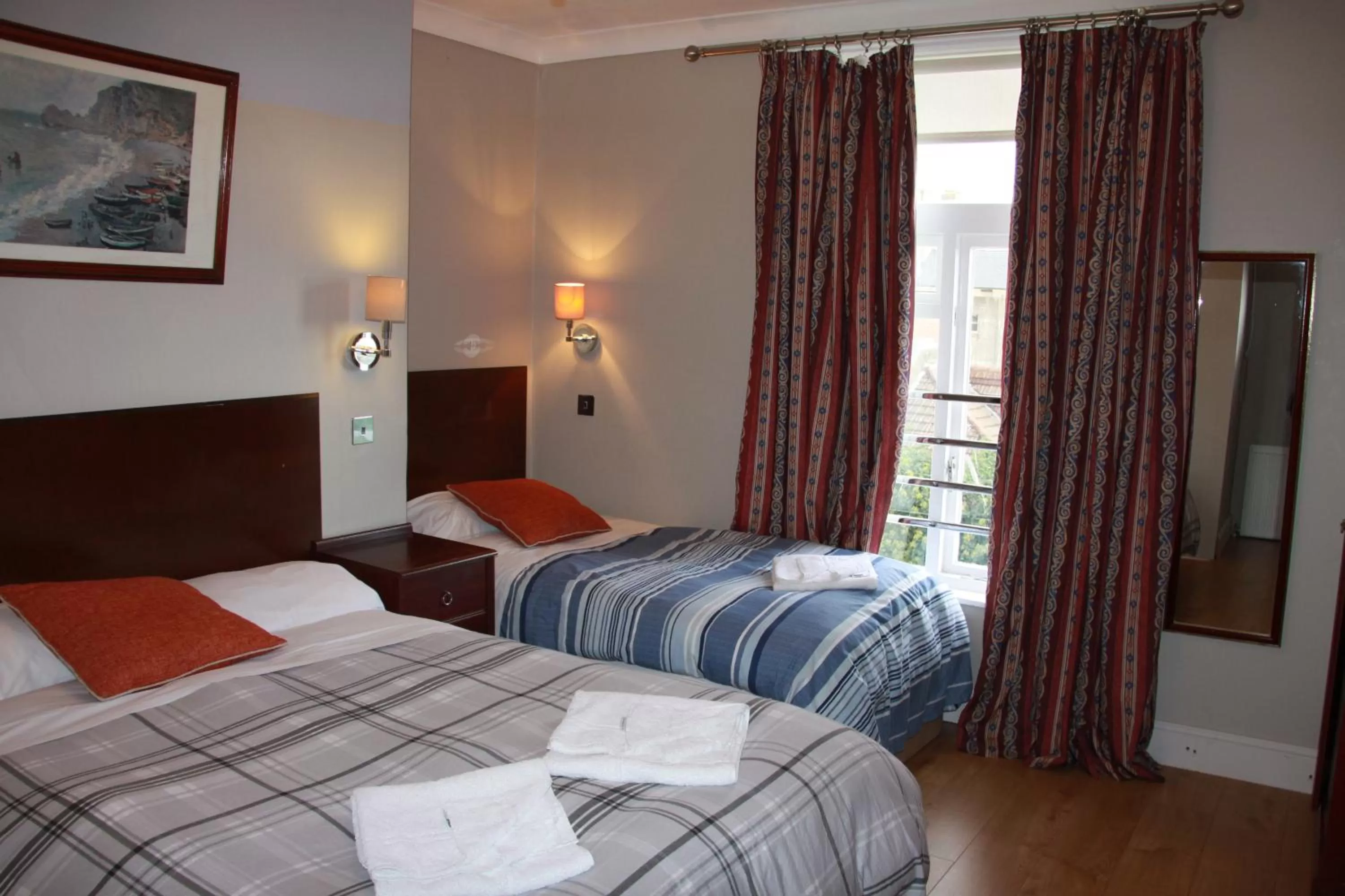 Bed in Ambassador Hotel