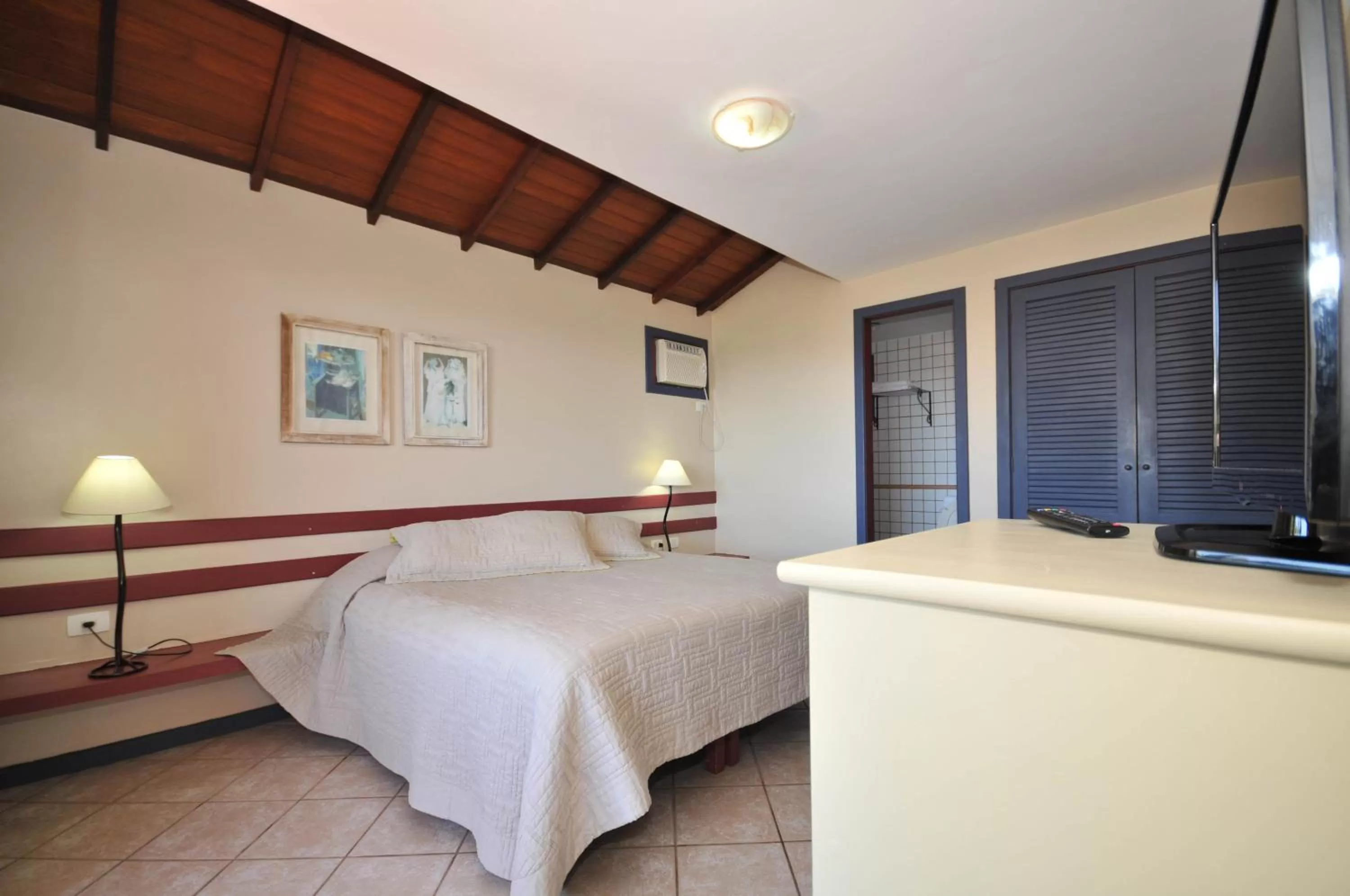 Bed in Aguabúzios Hotel