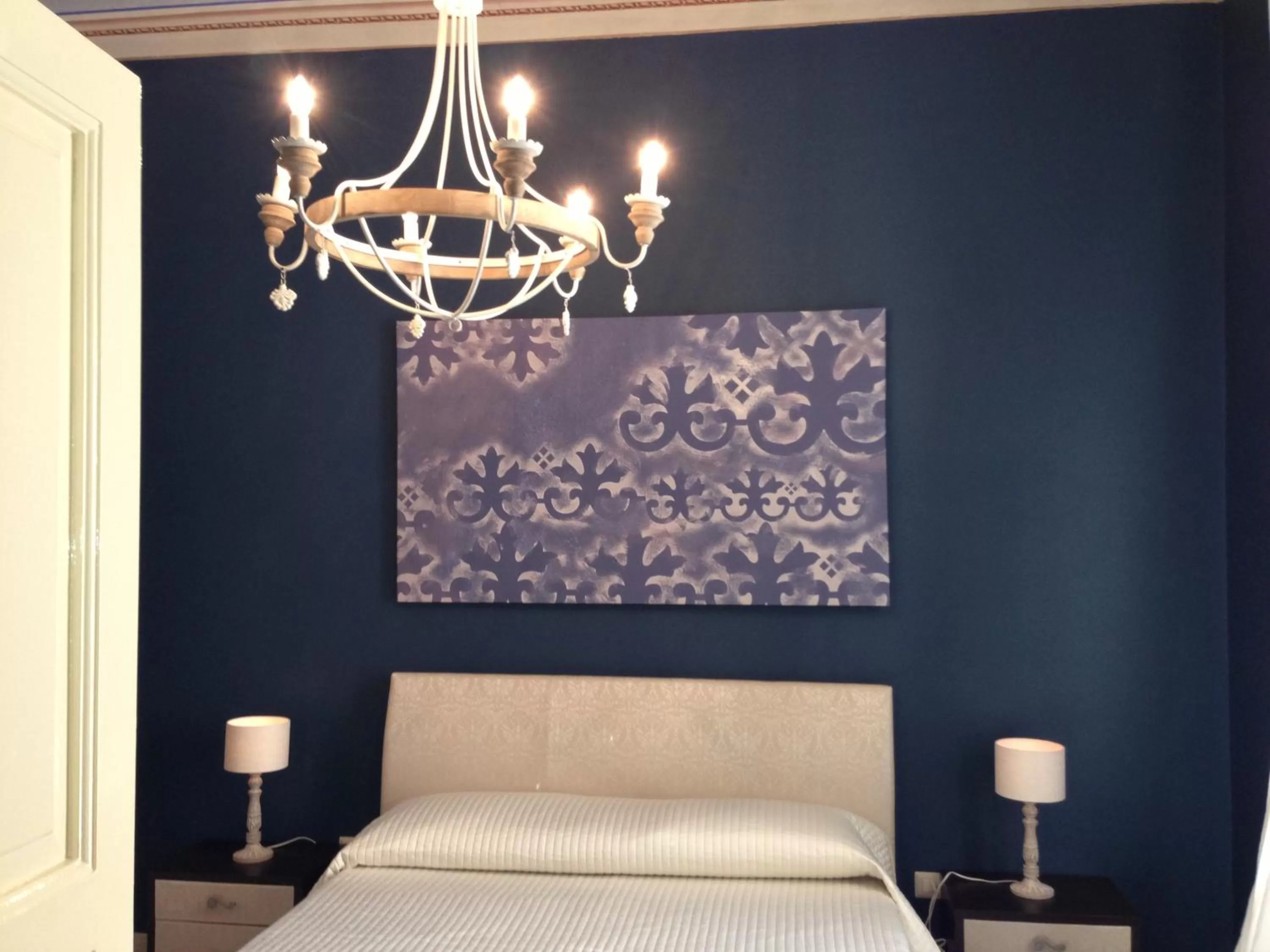 Decorative detail, Bed in Albergo Diffuso Dimora Rossi B&B