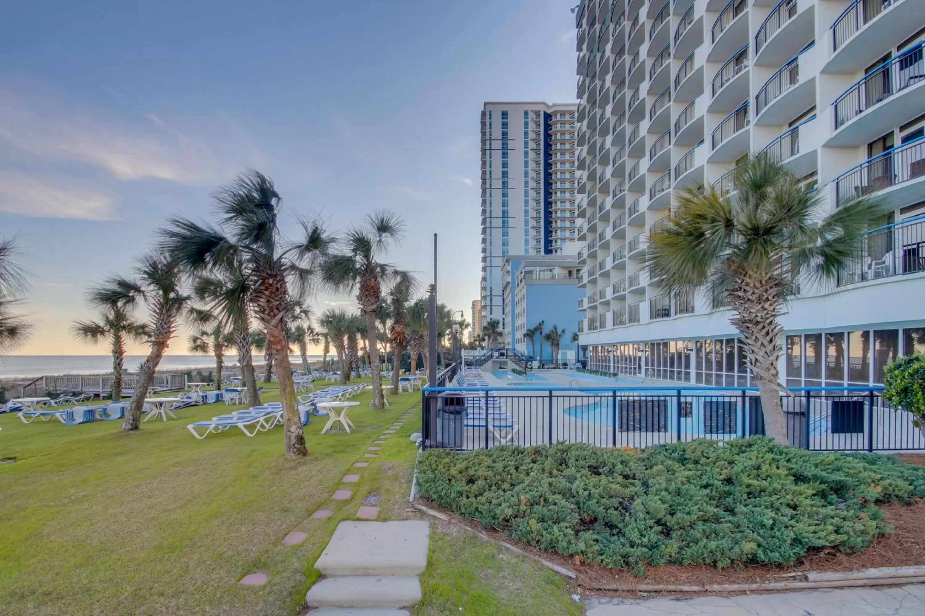 Swimming pool, Property Building in Boardwalk Beach Resort Condo w Oceanfront Balcony