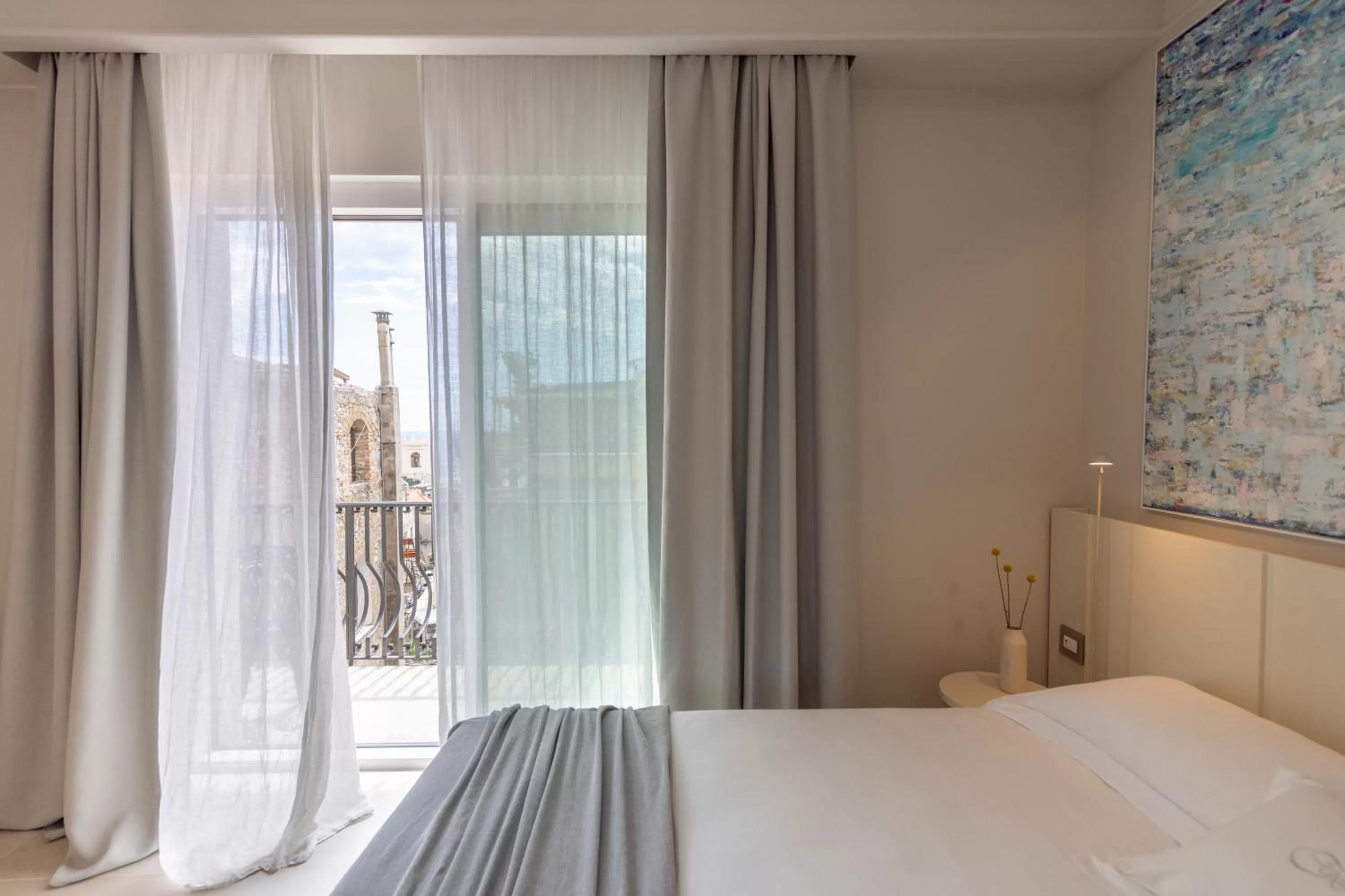 Bed in Taodomus Boutique Hotel