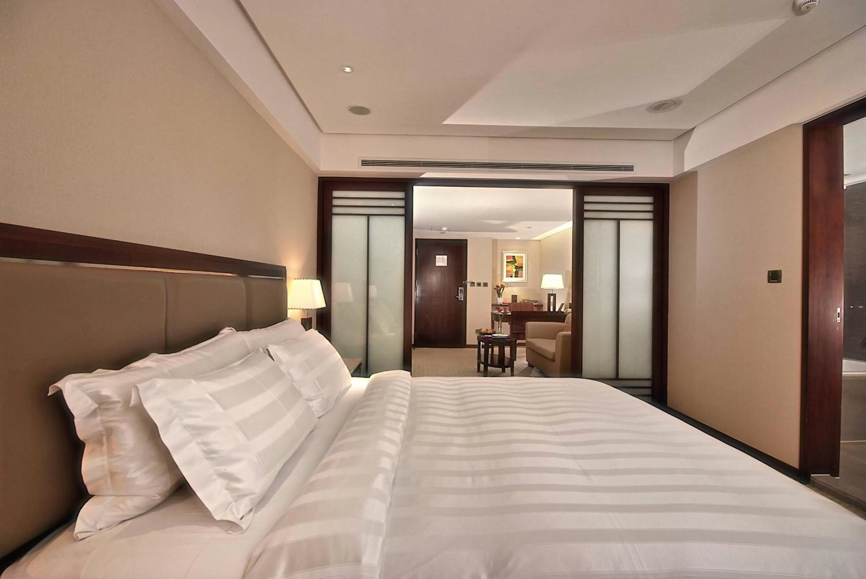 Bed in Royal Biz Taipei Hotel