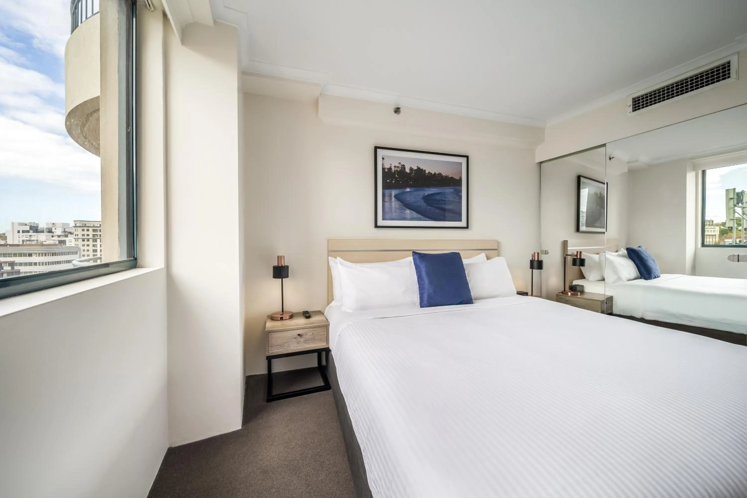 Bed in Oaks Sydney Castlereagh Suites