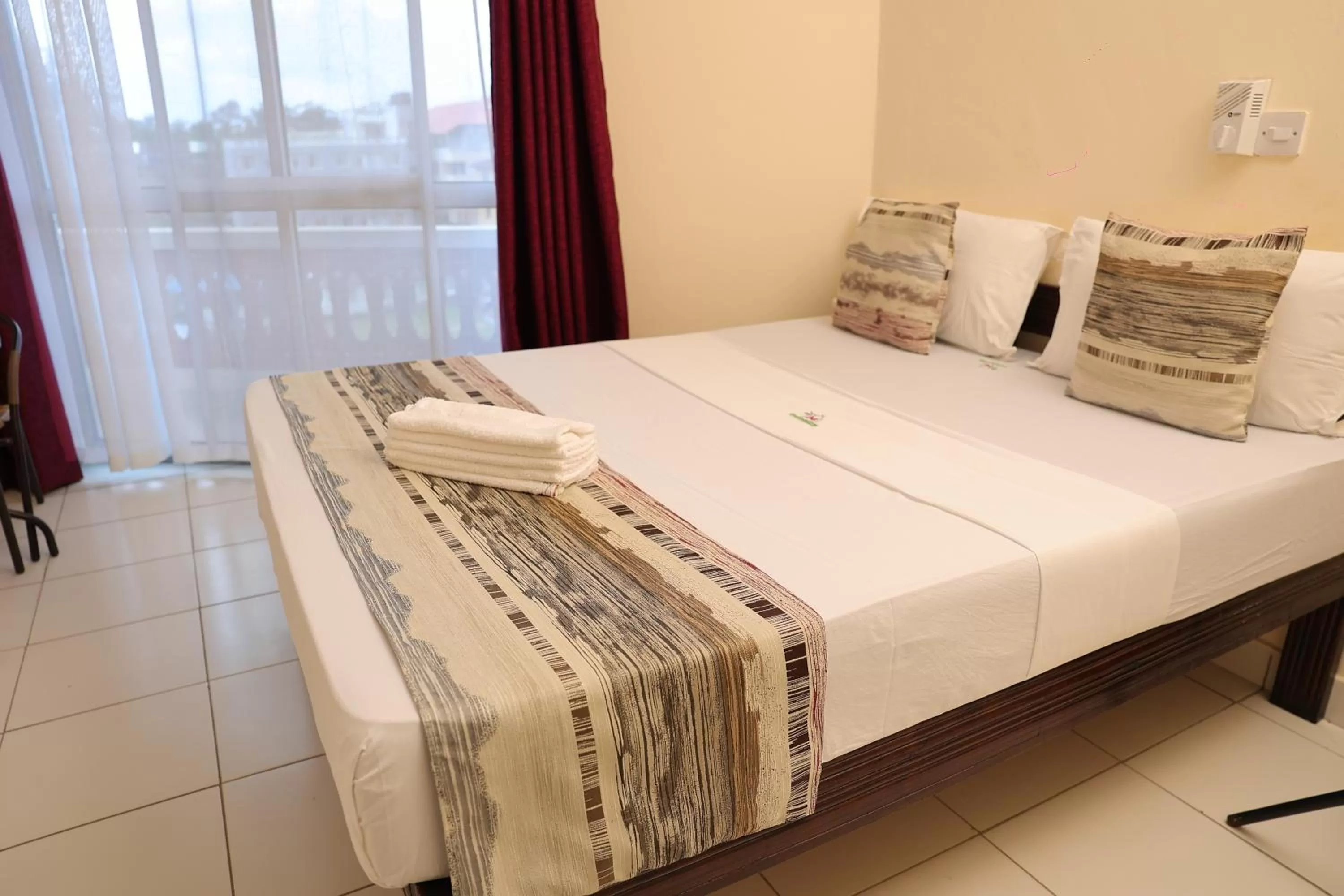 Bed in Merry Villa Hotel & Apartments