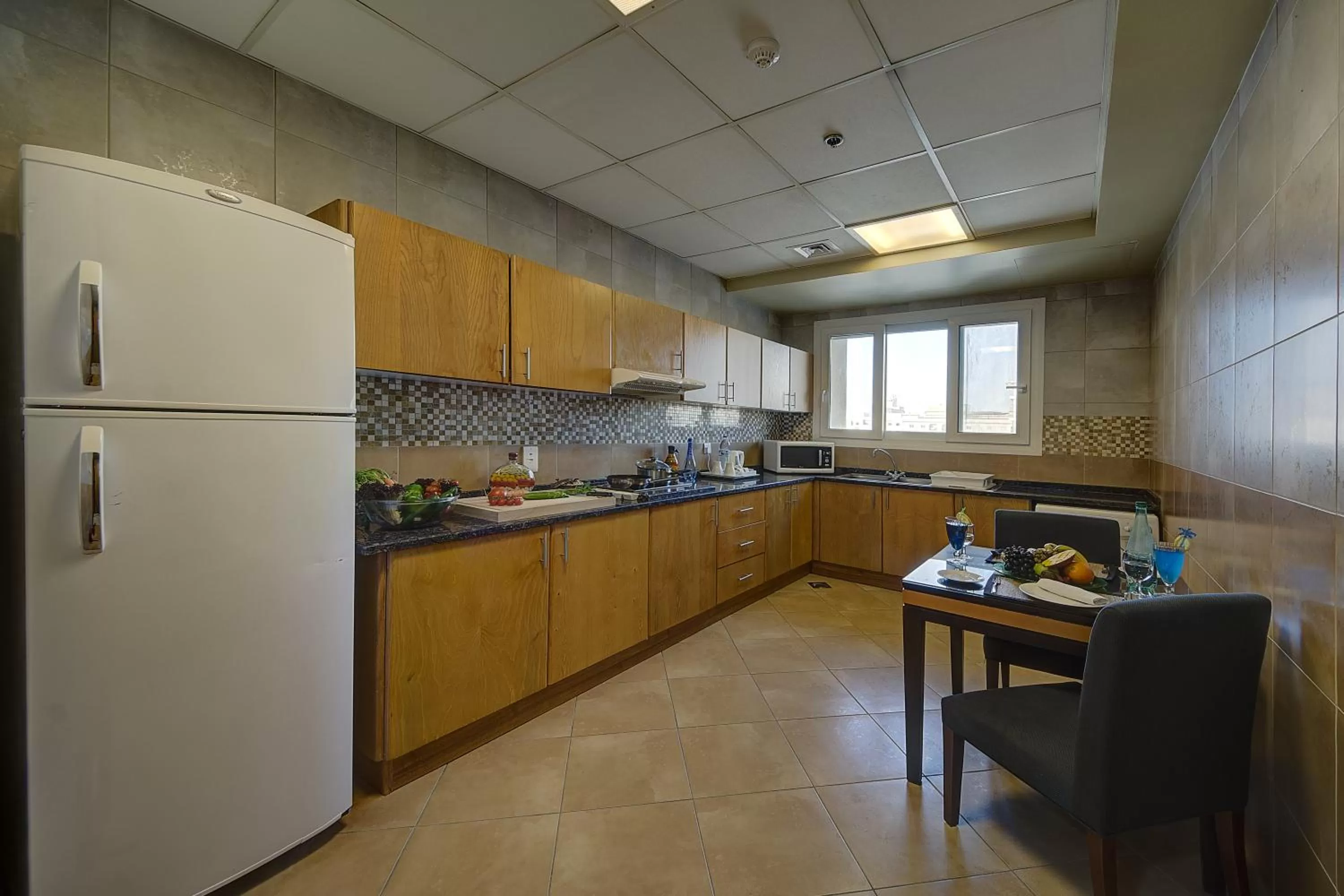Kitchen or kitchenette in Al Khoory Hotel Apartments Al Barsha
