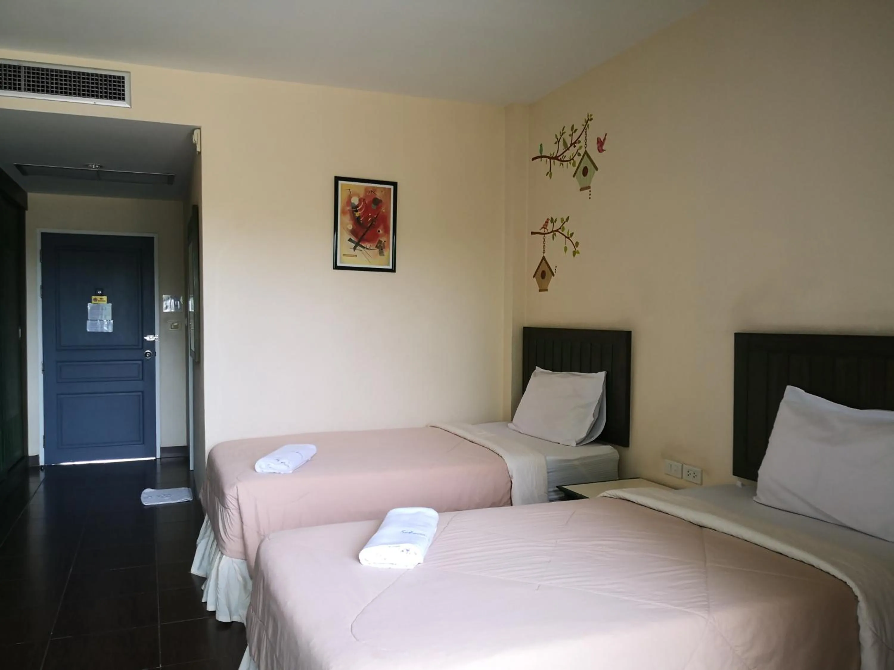 Bed in Baan Suksiri Hotel