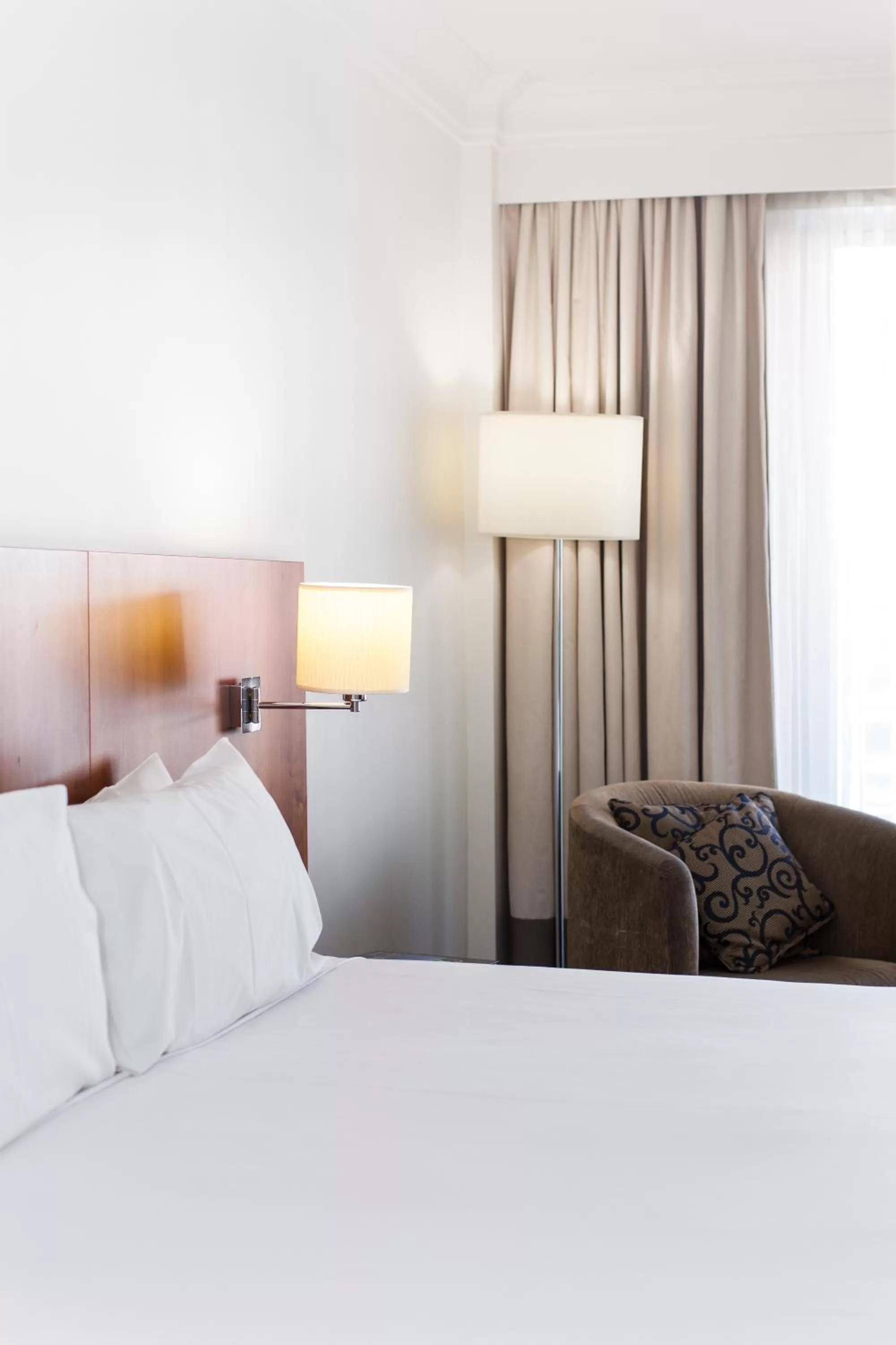 Bed in Majestic Roof Garden Hotel